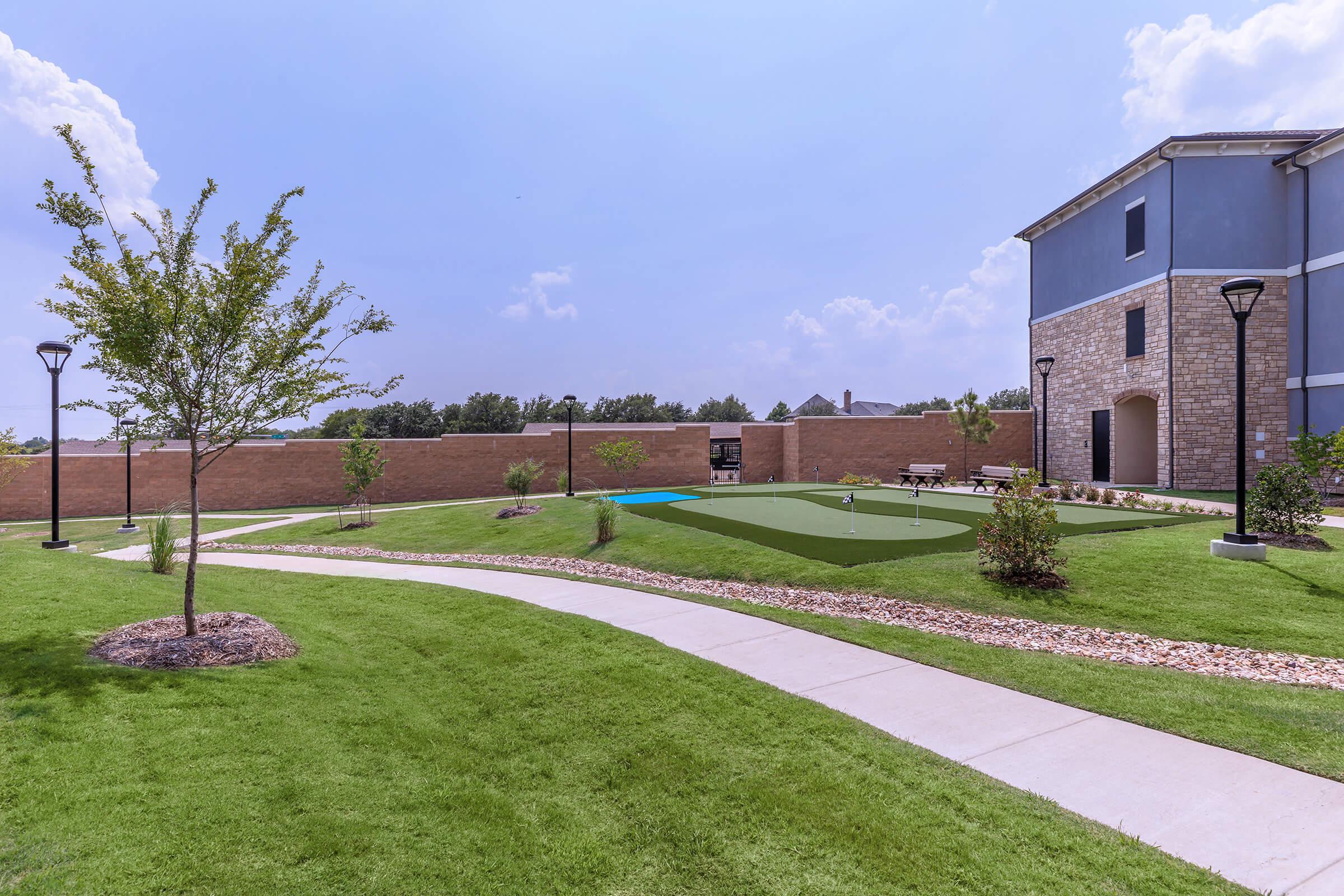 a large lawn in front of a building