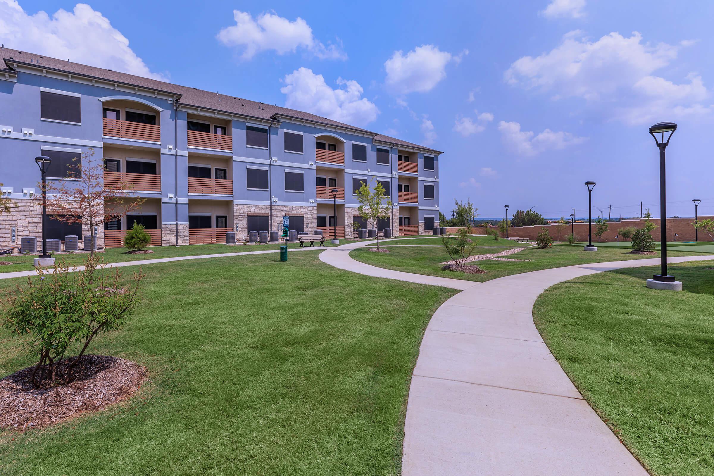 a large lawn in front of a building