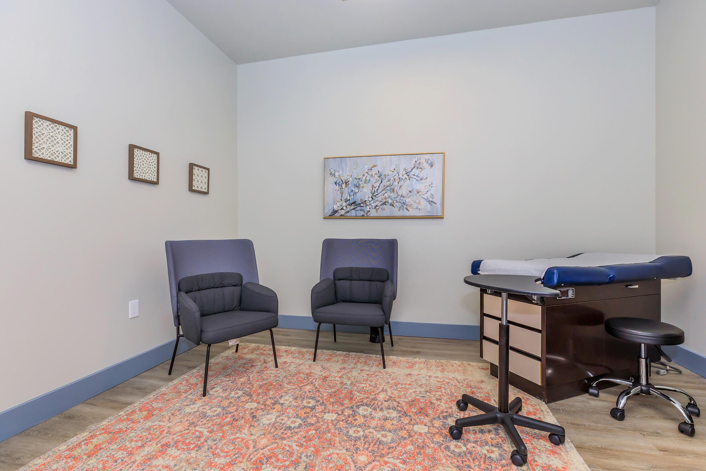 a living room filled with furniture and a rug