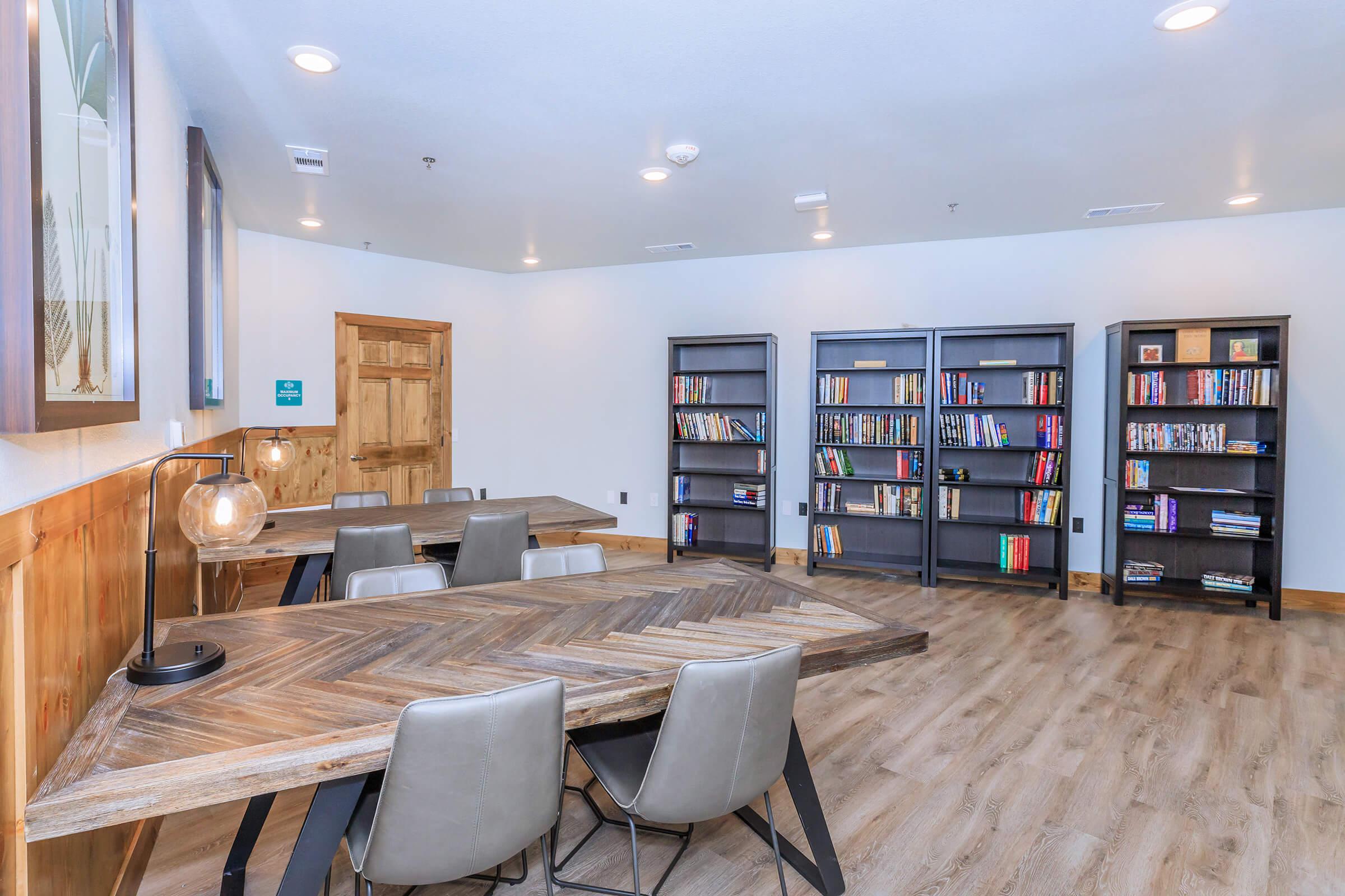 a living room filled with furniture and a flat screen tv