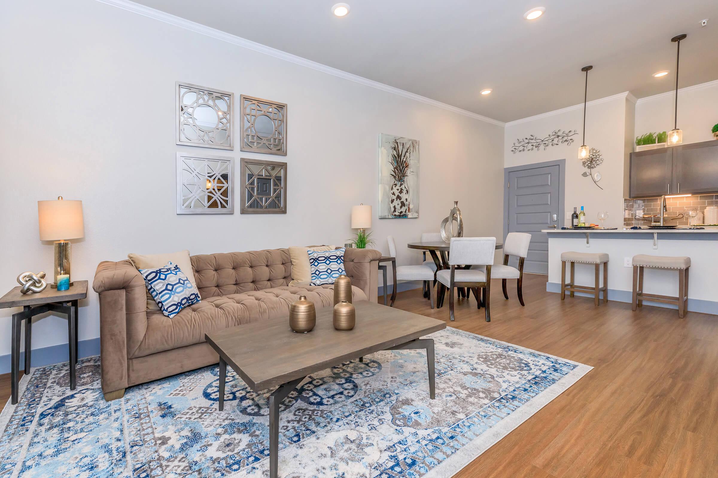 a living room filled with furniture and a fireplace