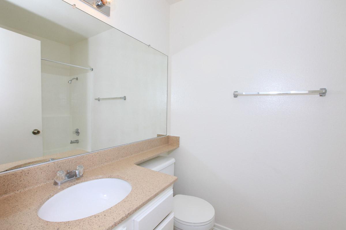 Bathroom with tan countertops