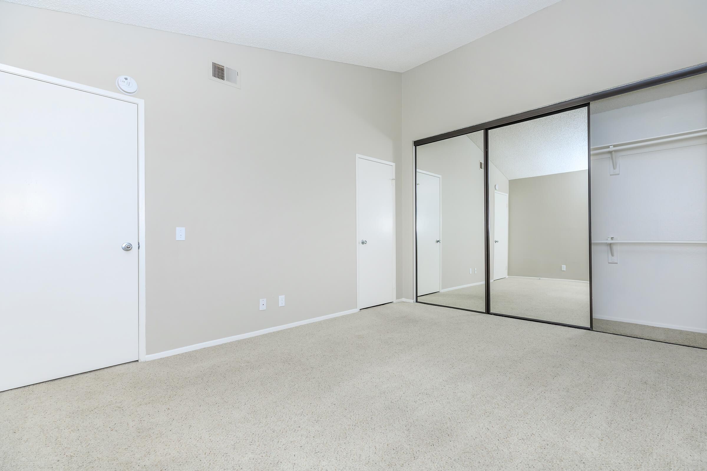 Vacant bedroom with carpet