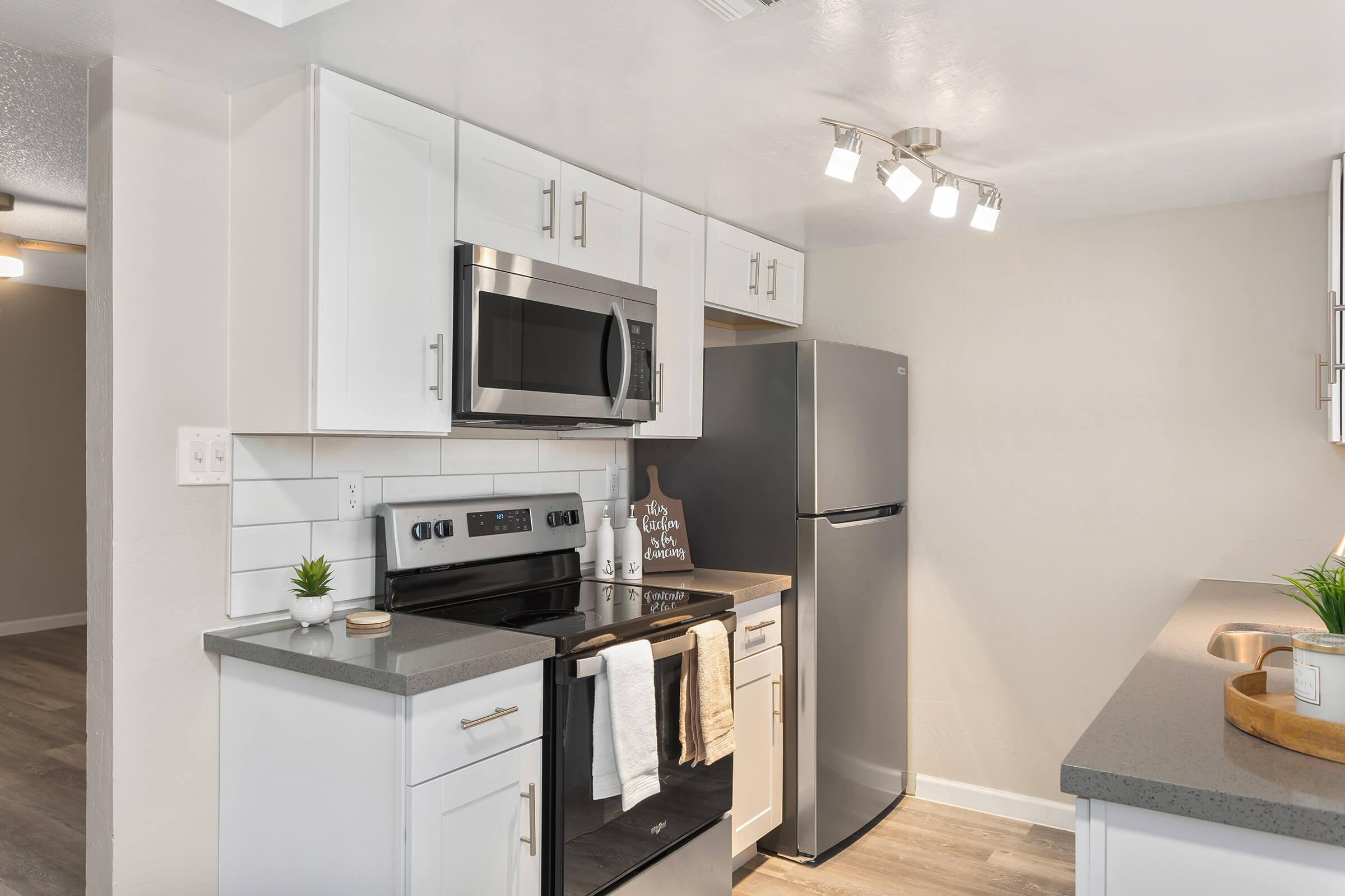 a kitchen with a sink and a microwave