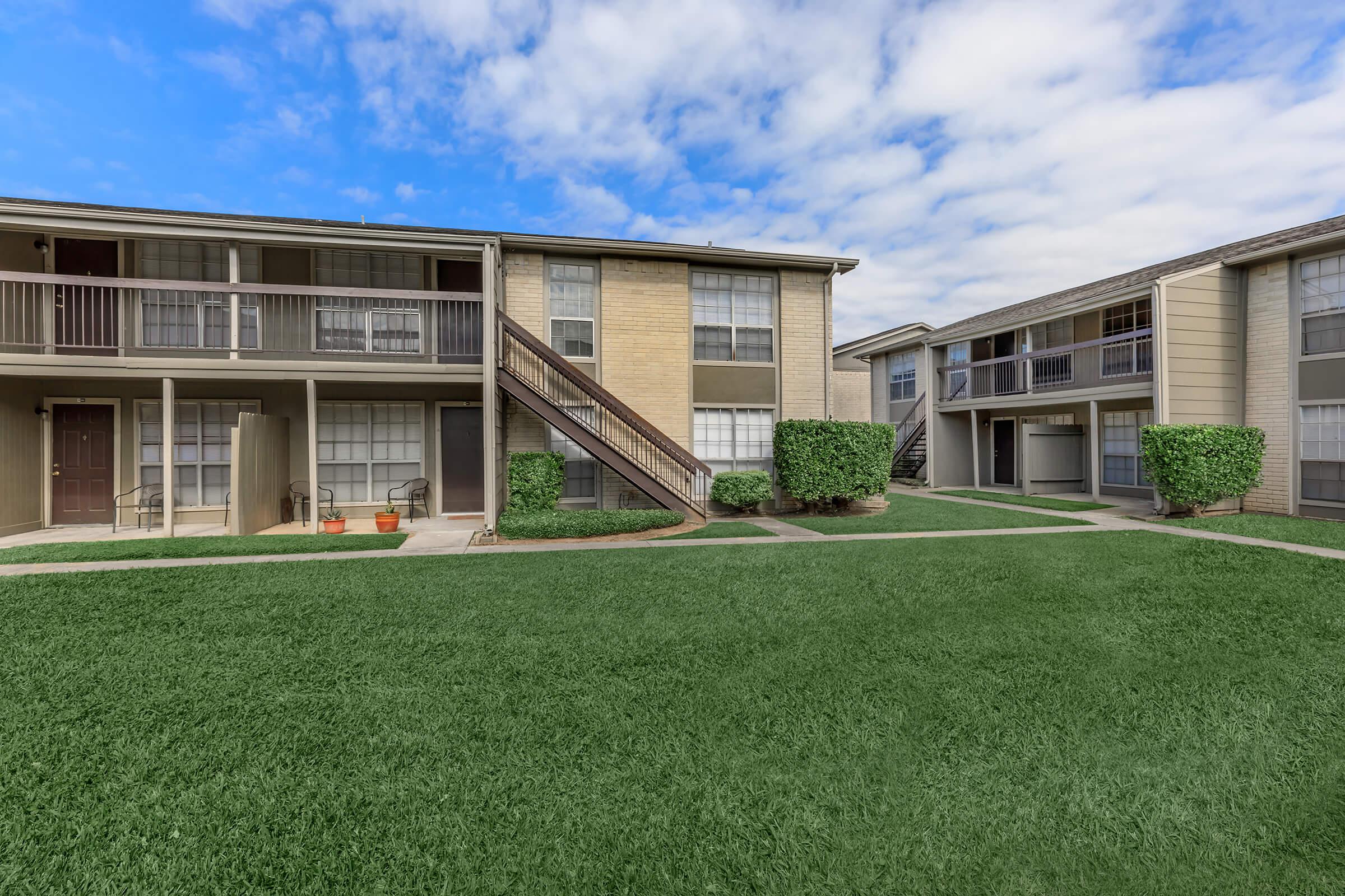 a large lawn in front of a house