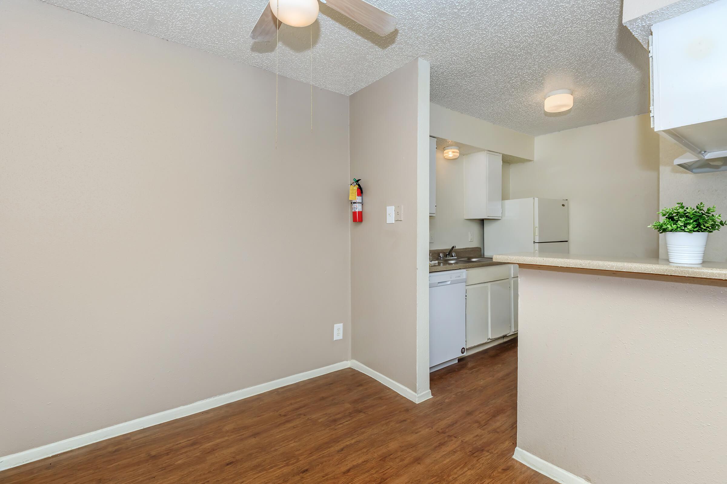 a kitchen with a sink and a refrigerator