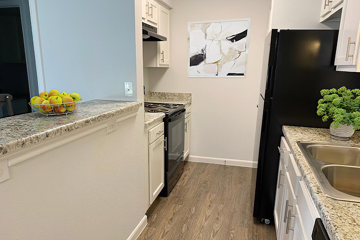 a kitchen filled with appliances and cabinets