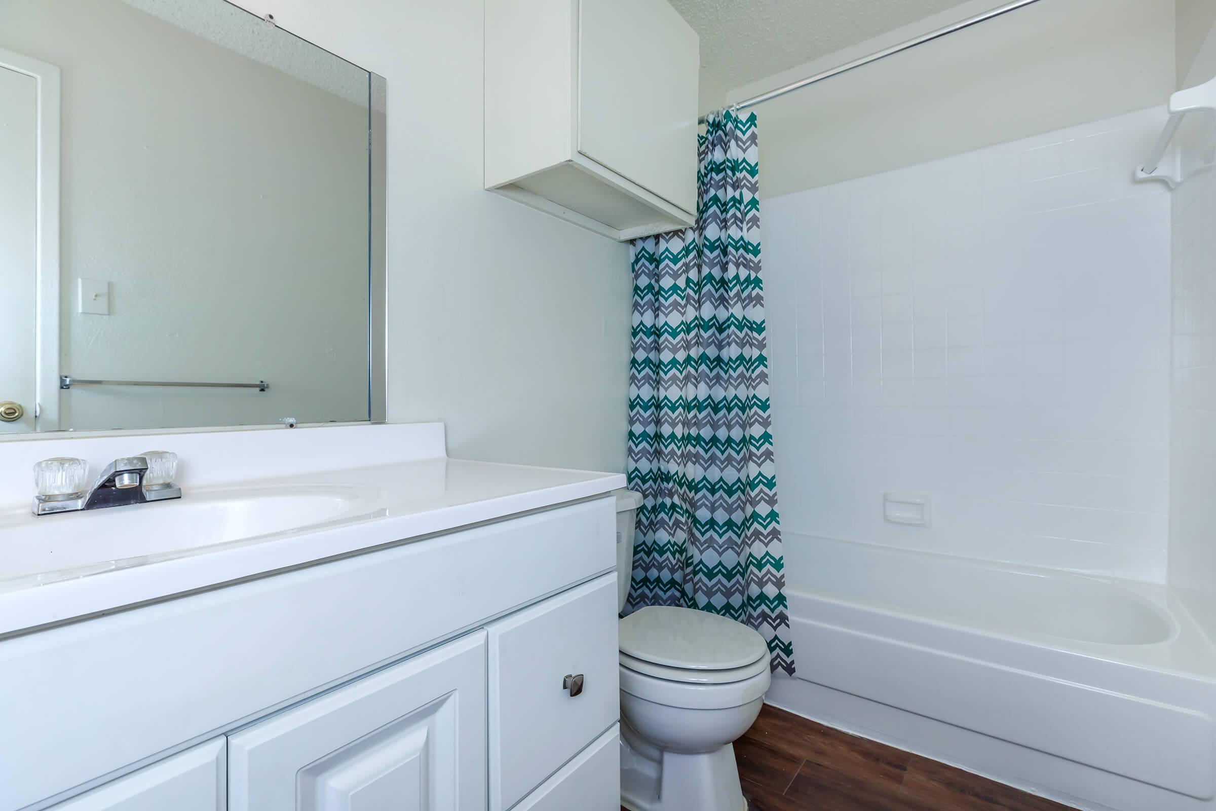 a kitchen with a sink and a shower