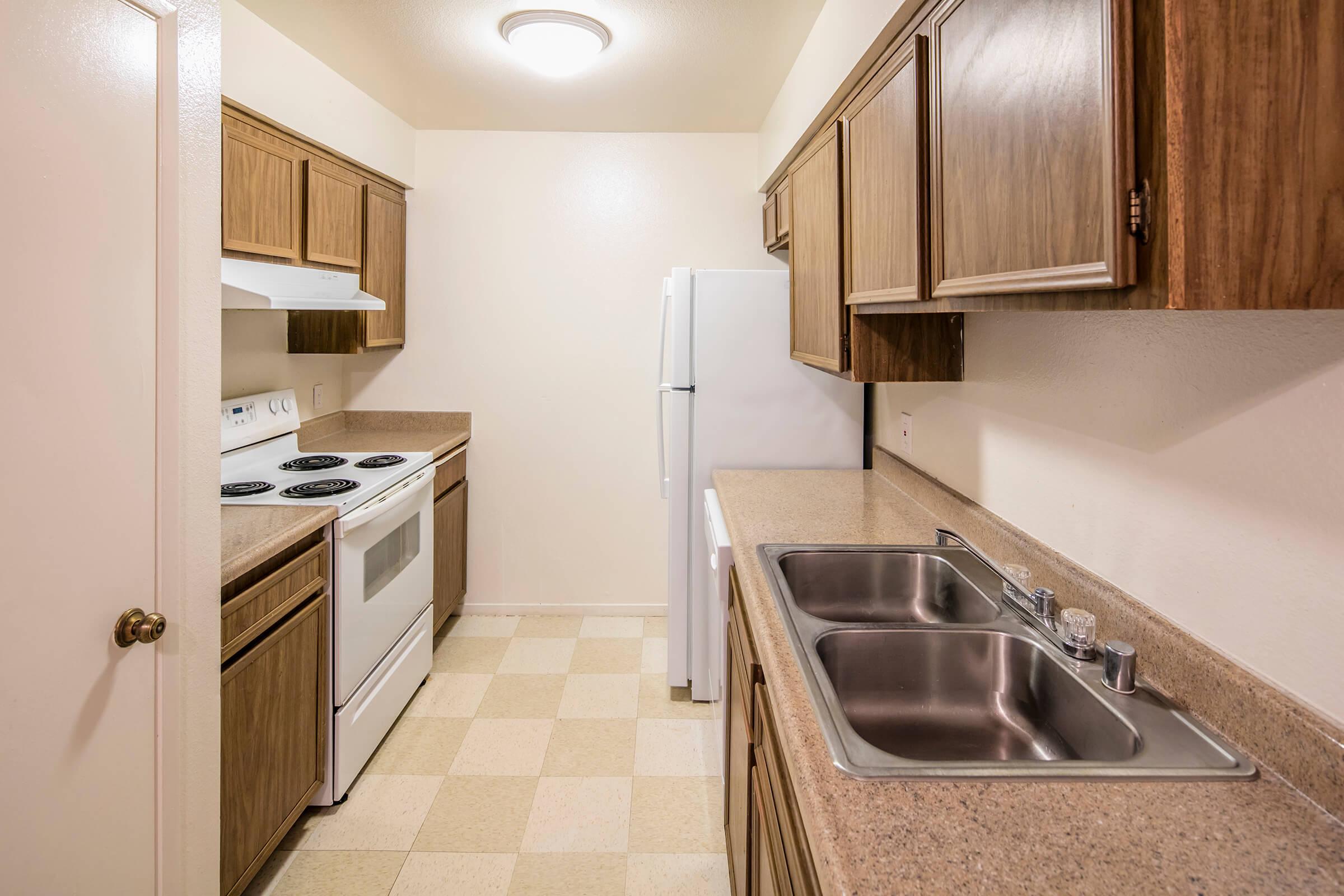 a kitchen with a sink and a microwave