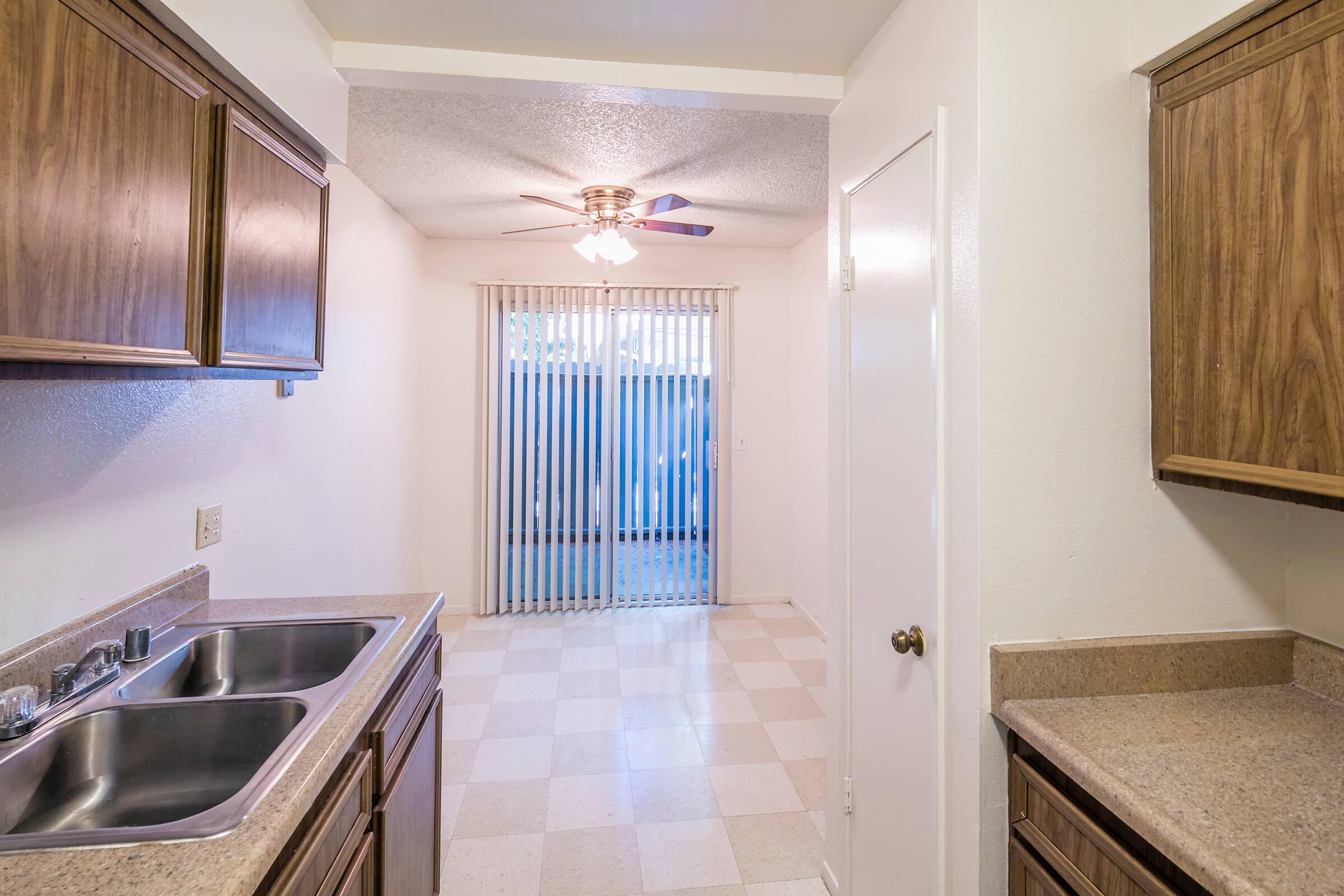 a kitchen with a sink and a window