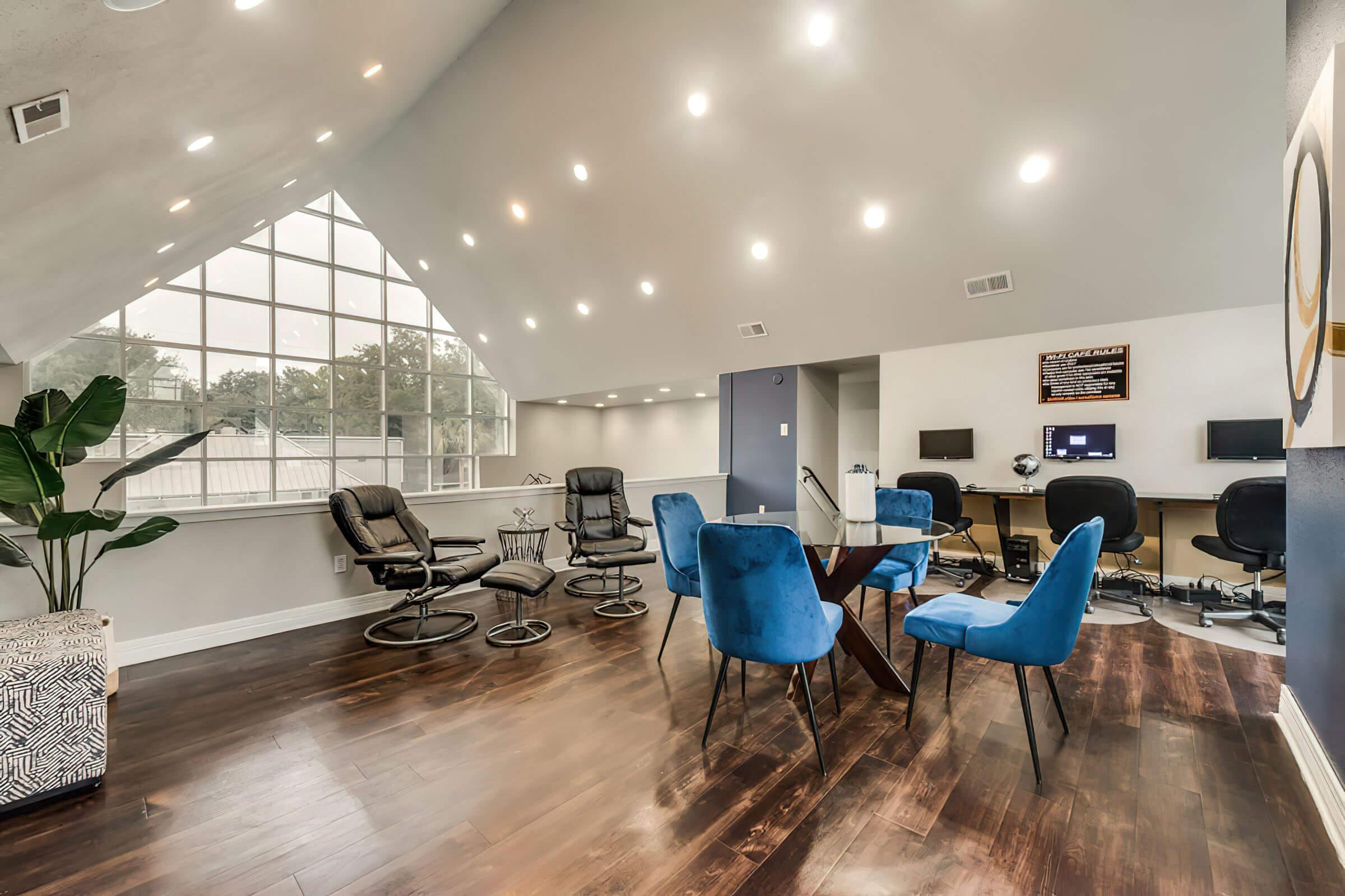 a room filled with furniture and a blue chair
