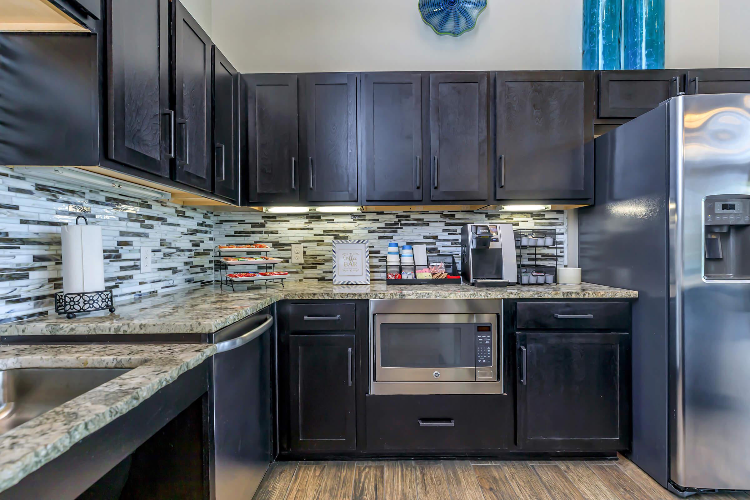 community kitchen with wooden cabinets