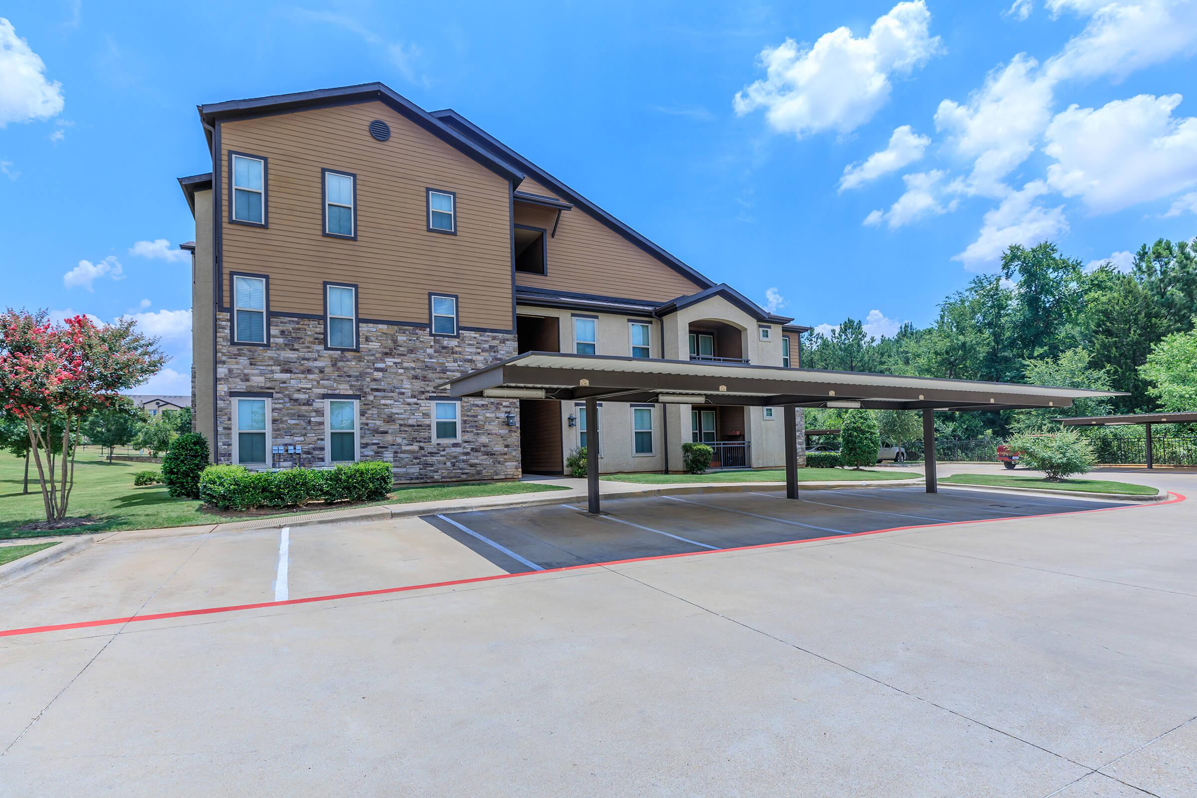 community building with covered parking spots