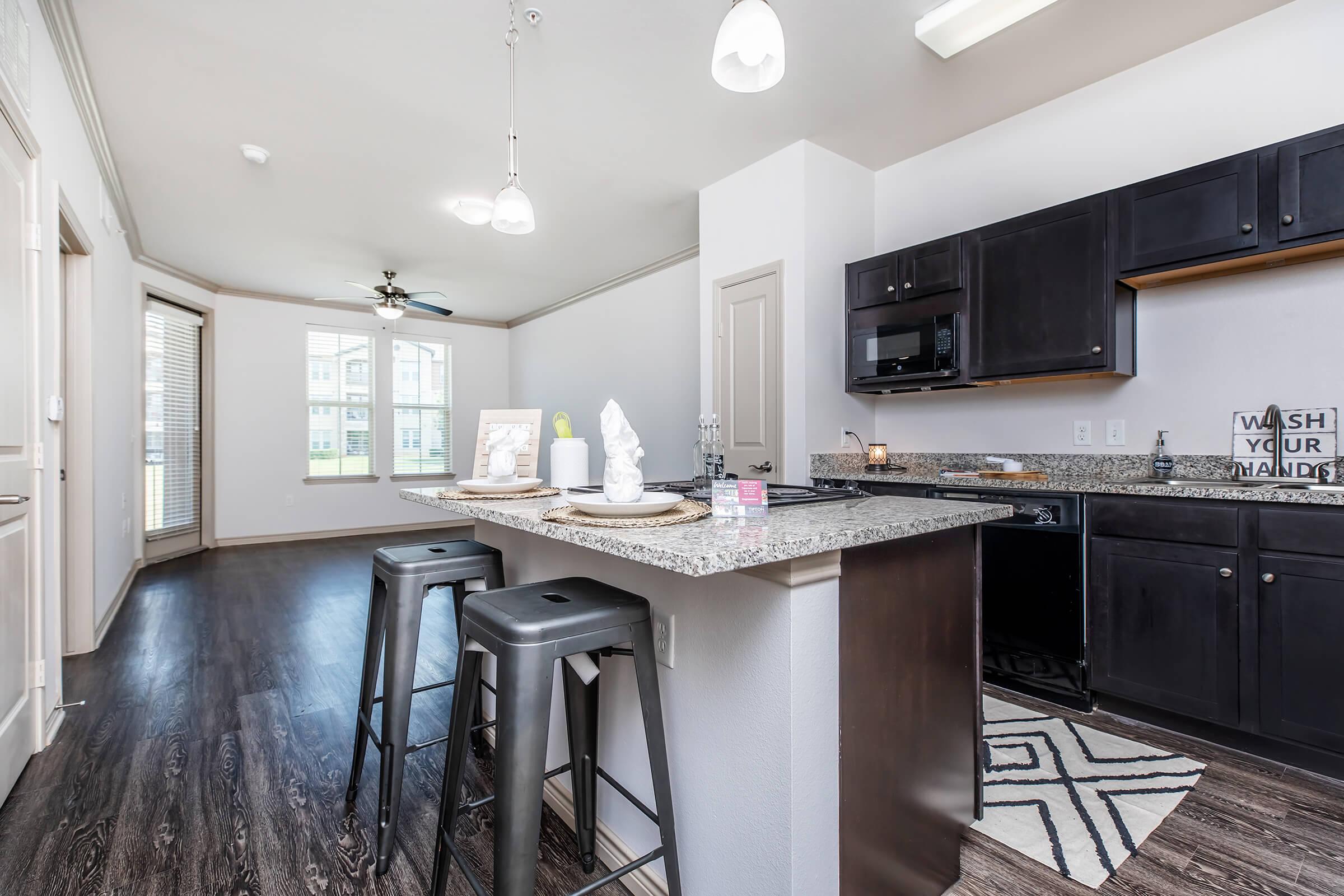 a kitchen with a sink and a window