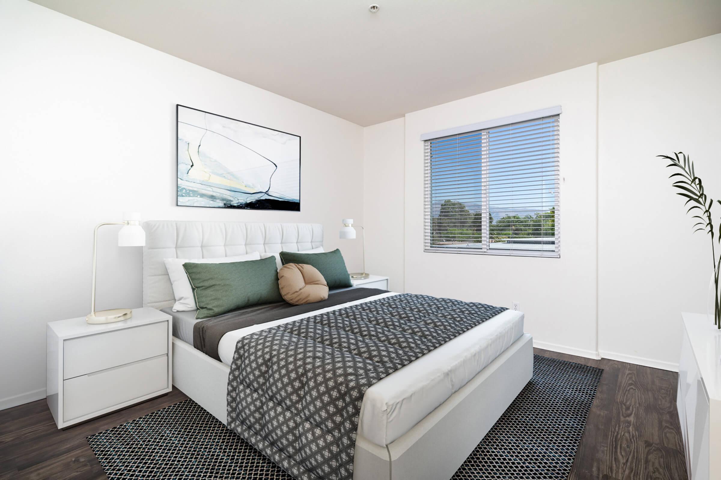 a living room with a bed and a window