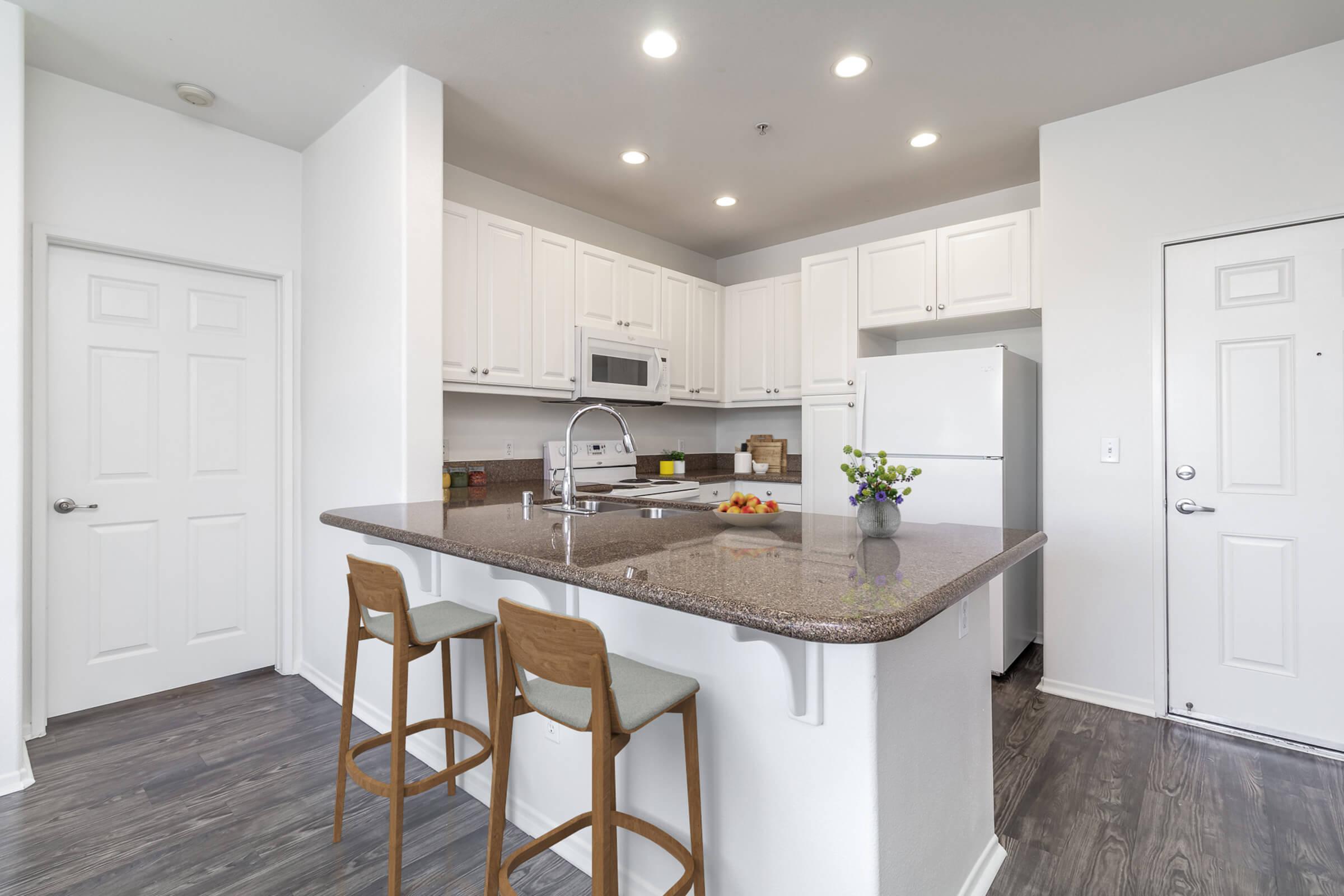 a kitchen with a sink and a refrigerator