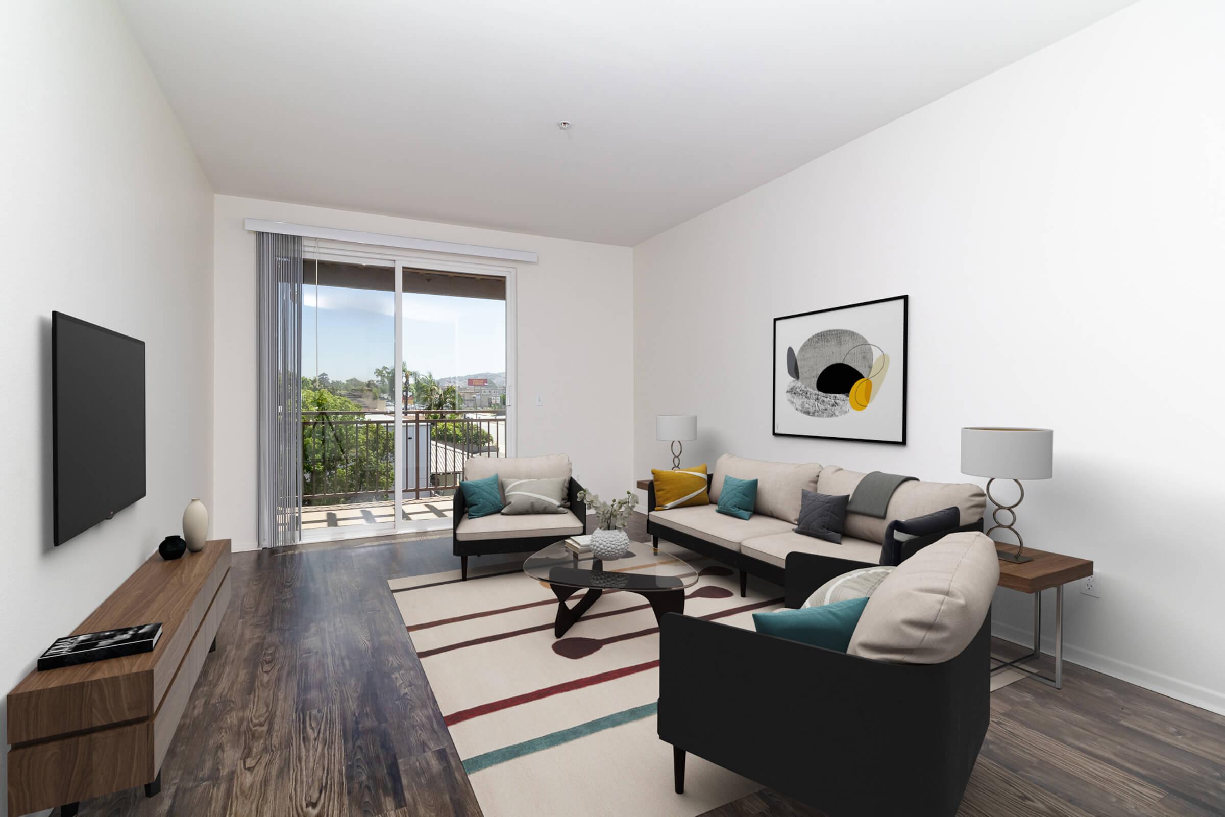a living room filled with furniture and a flat screen tv