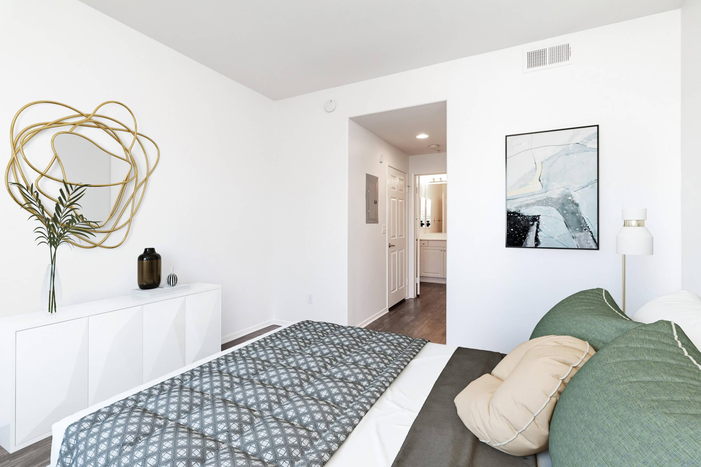 a bedroom with a bed in a room