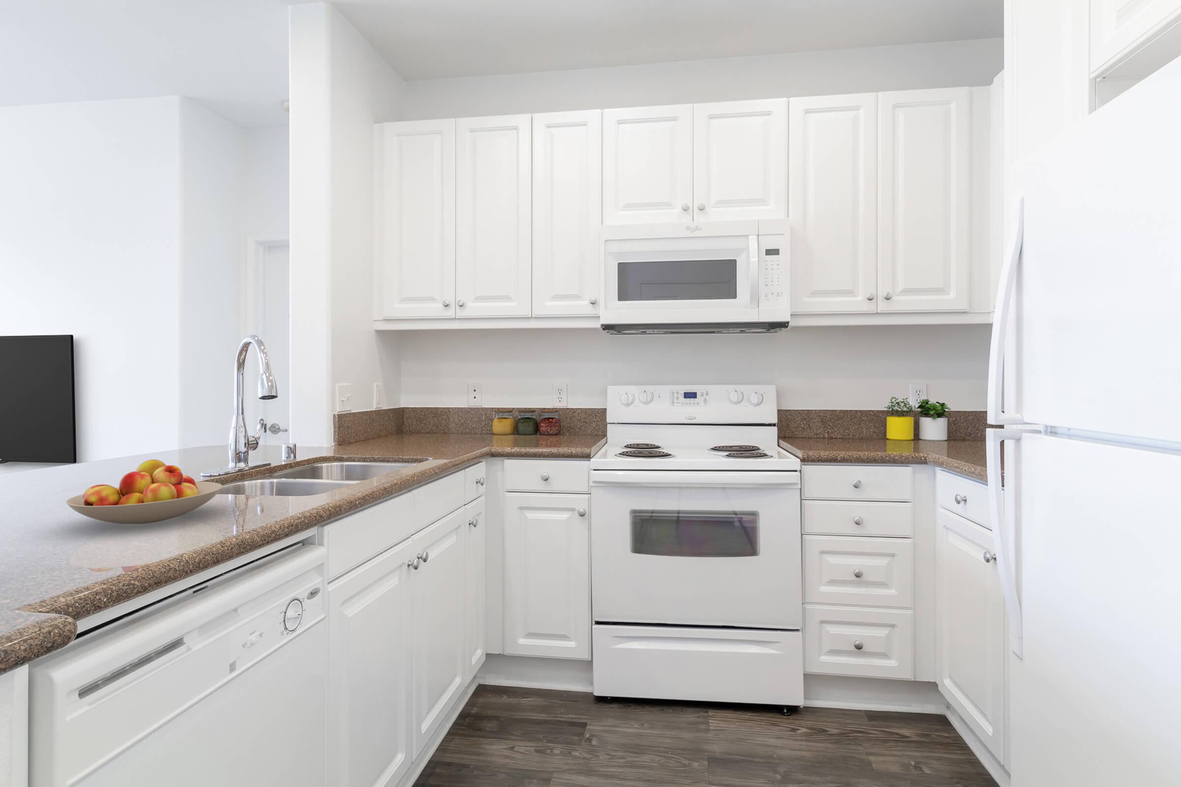 a kitchen with a stove and a refrigerator