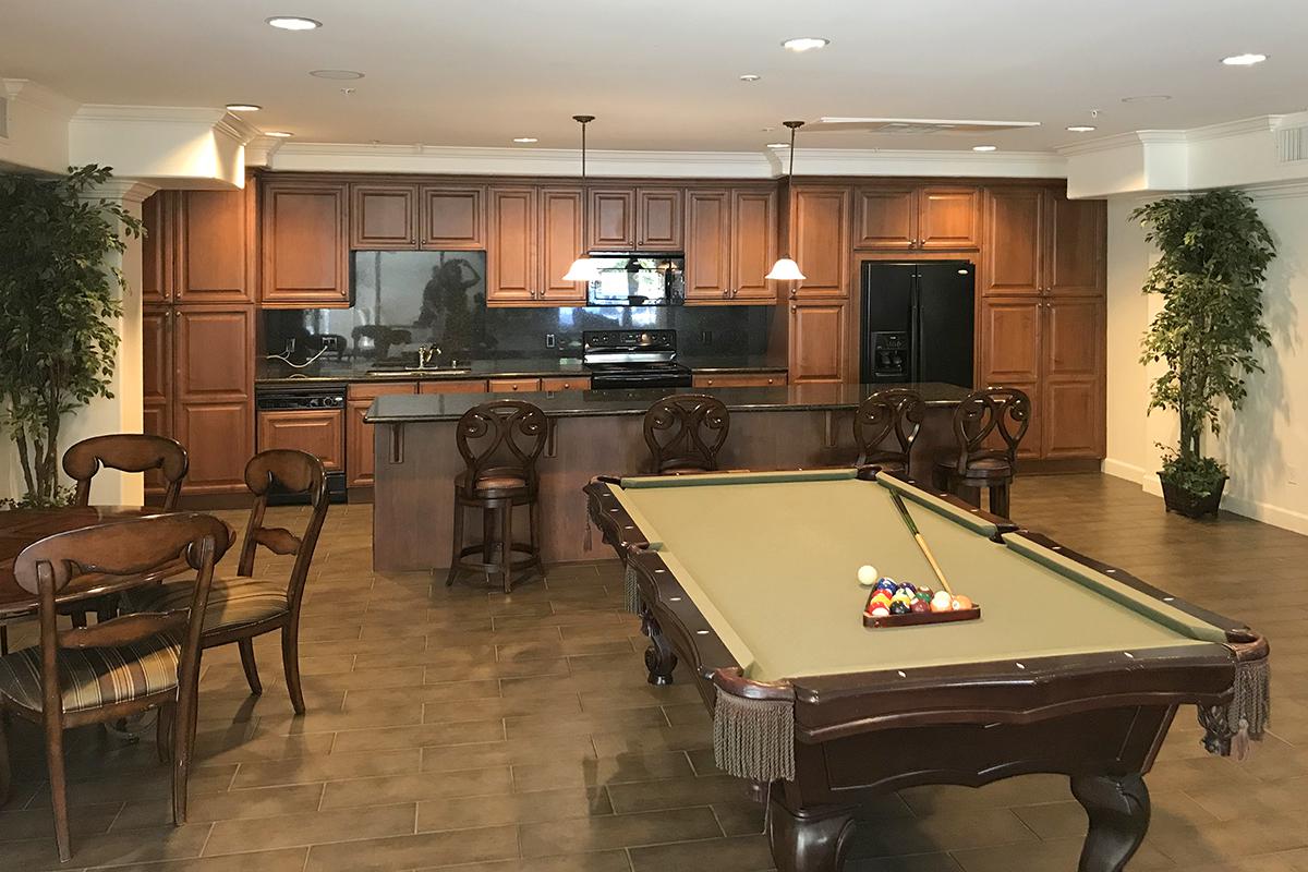 a living room filled with furniture and a stove