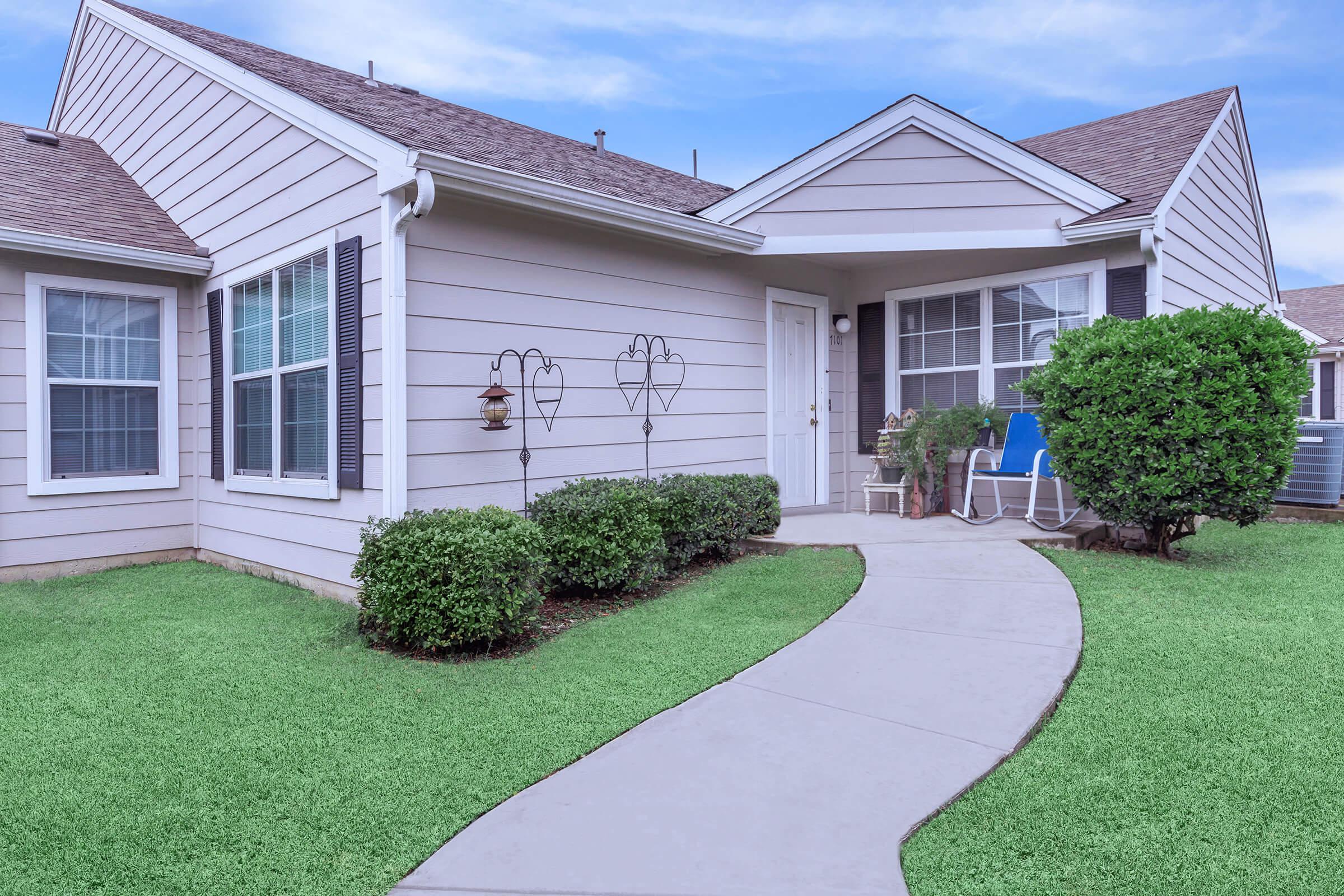 a large lawn in front of a house