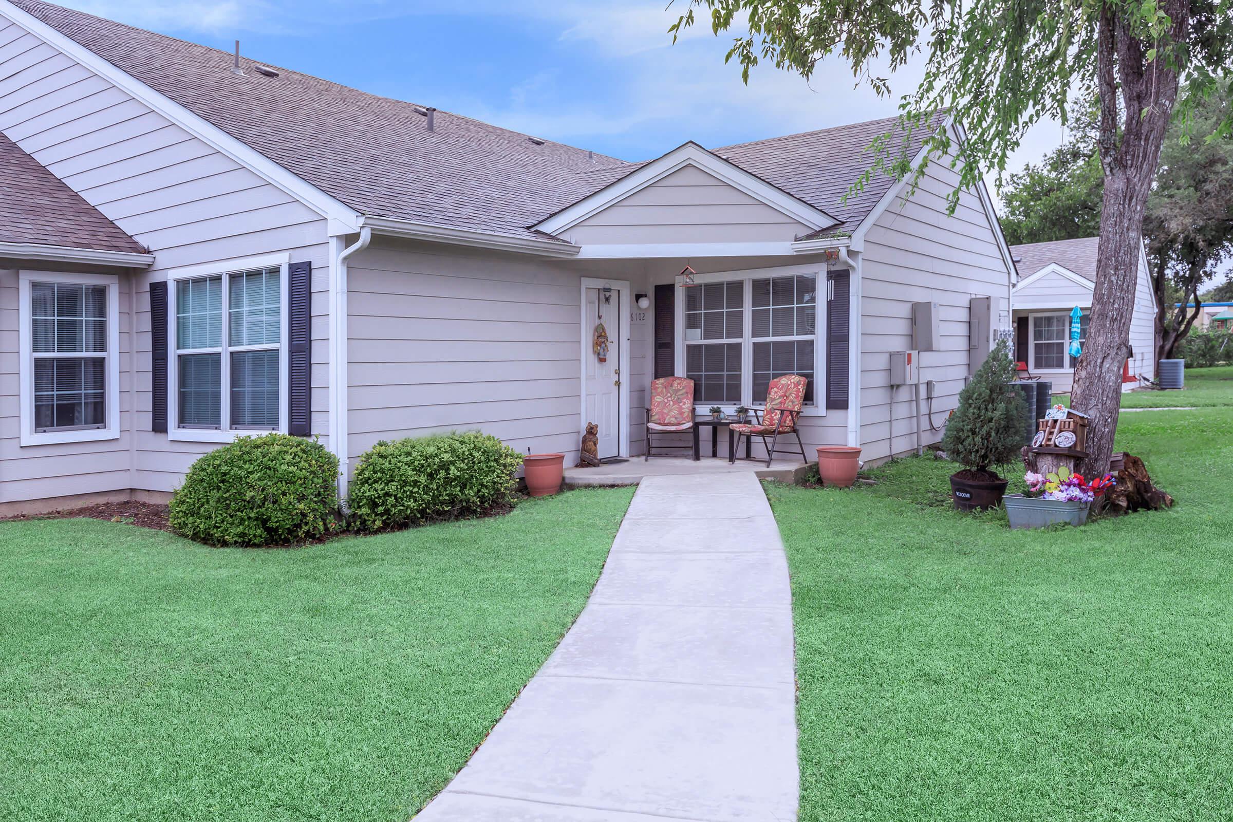 a large lawn in front of a house