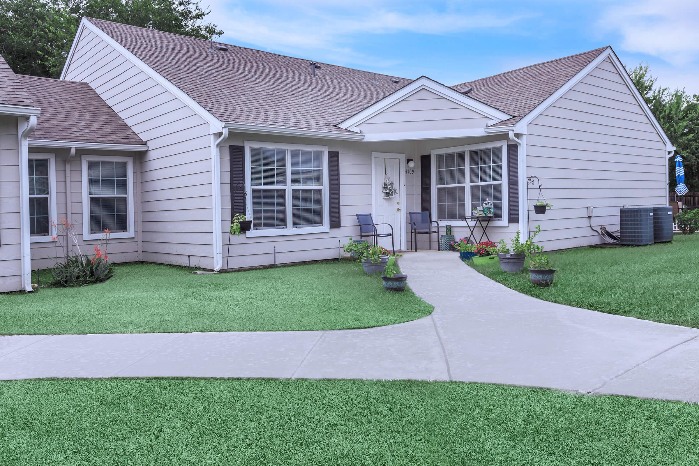 a large lawn in front of a house