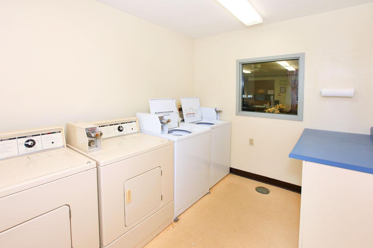 a white refrigerator freezer sitting inside of a kitchen