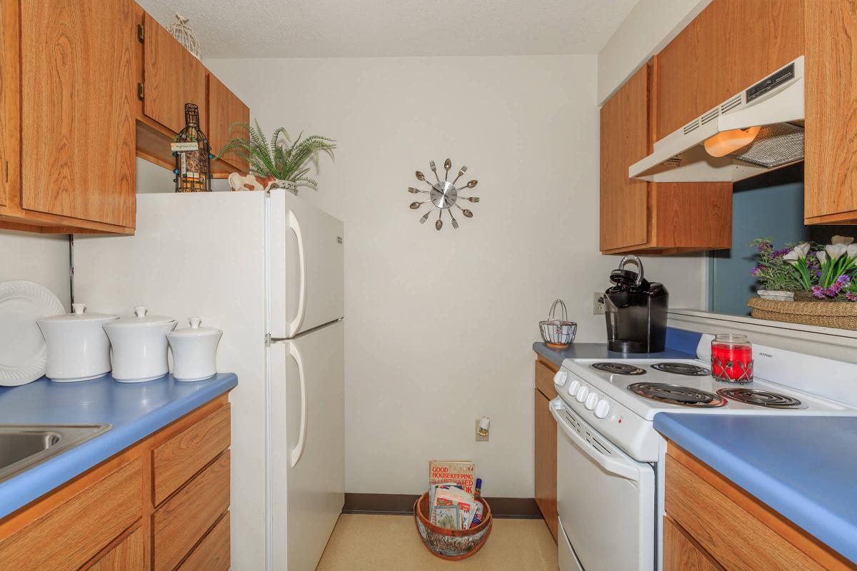 a kitchen with a sink and a refrigerator