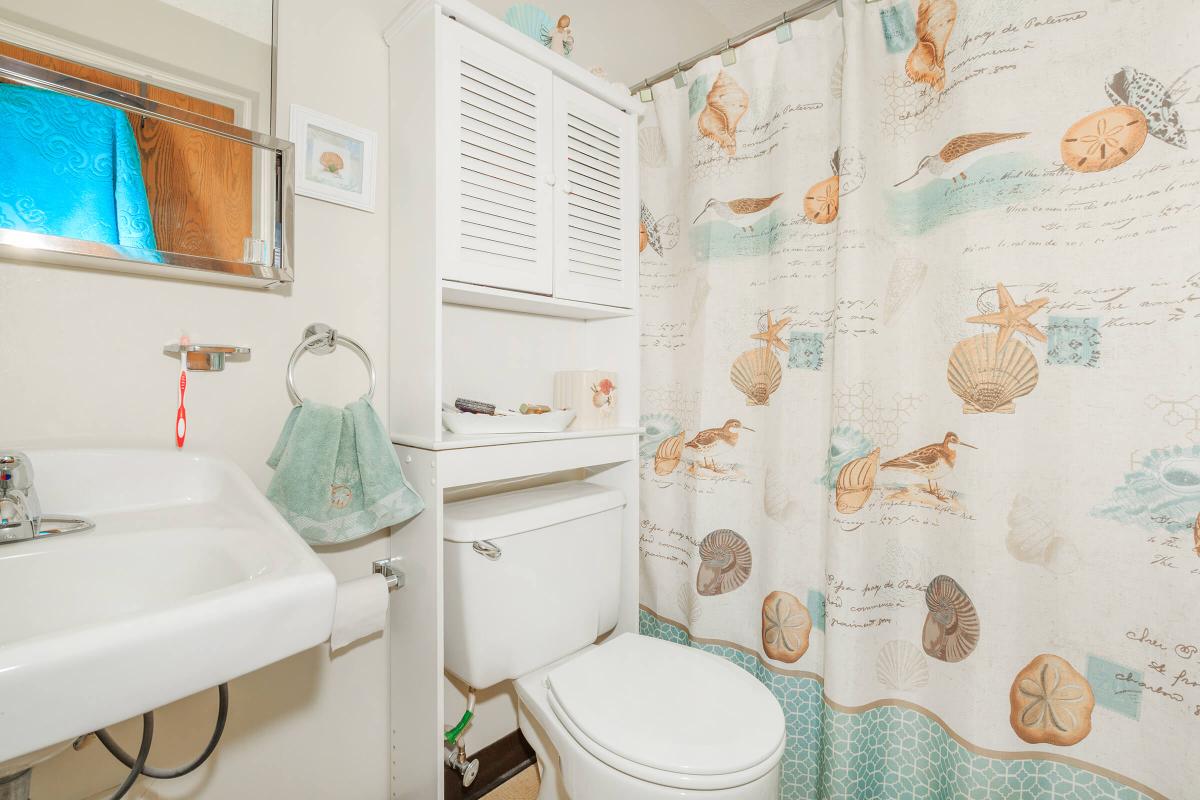 a white sink and a mirror