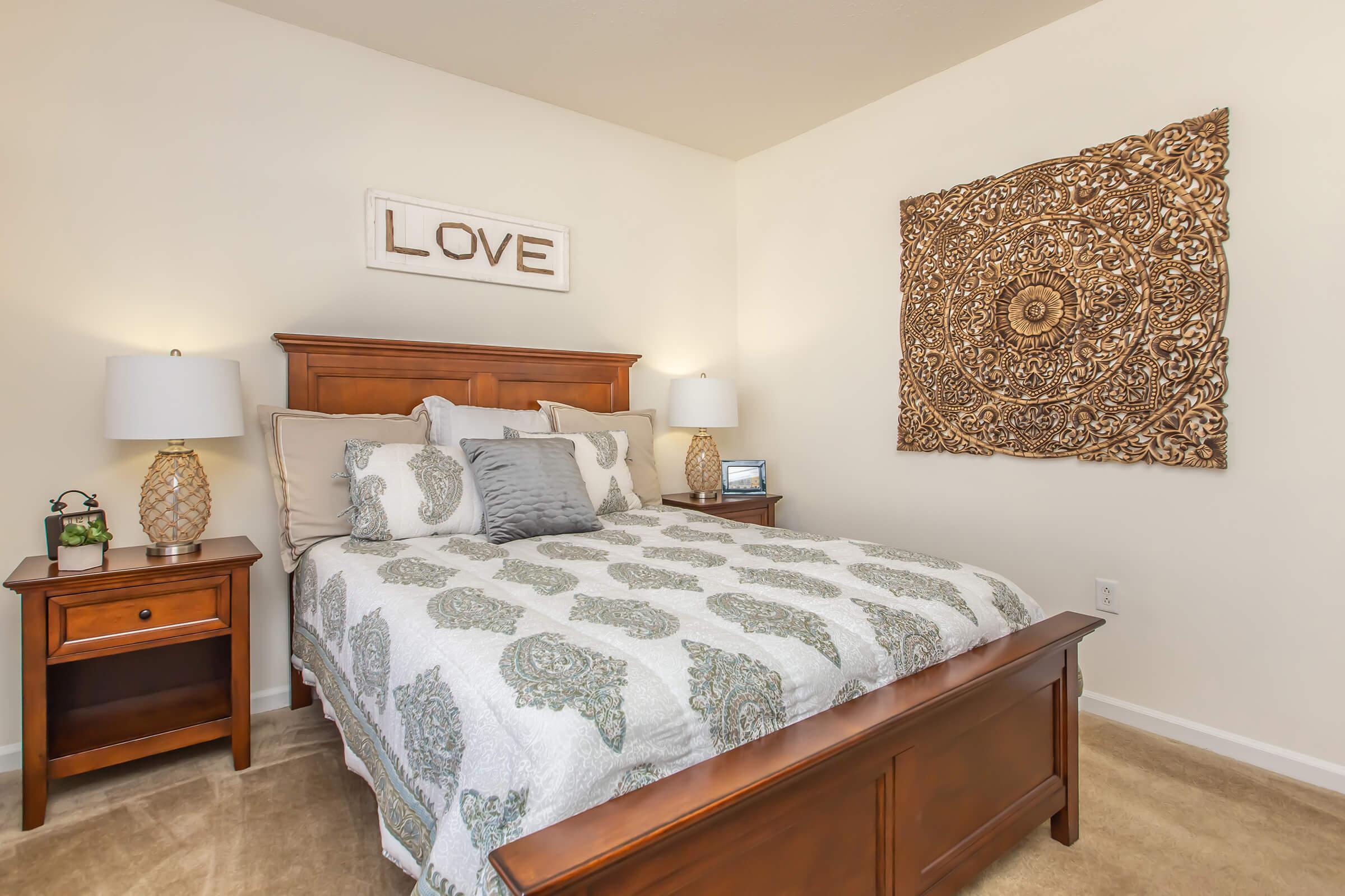 a bedroom with a bed in a room