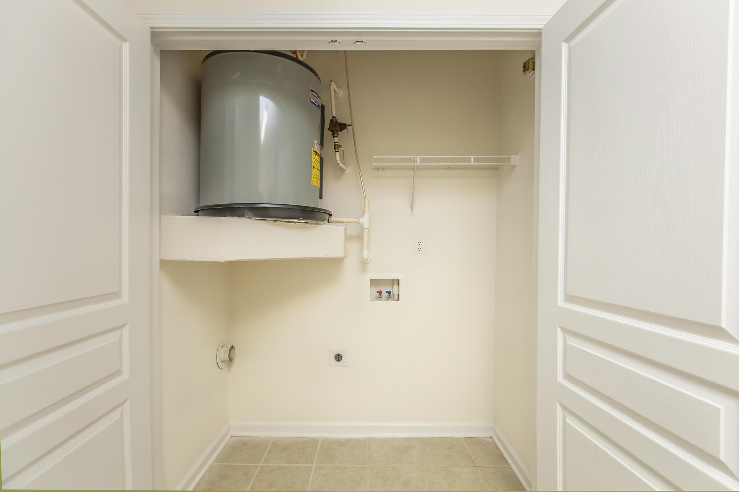 a white sink sitting next to a door
