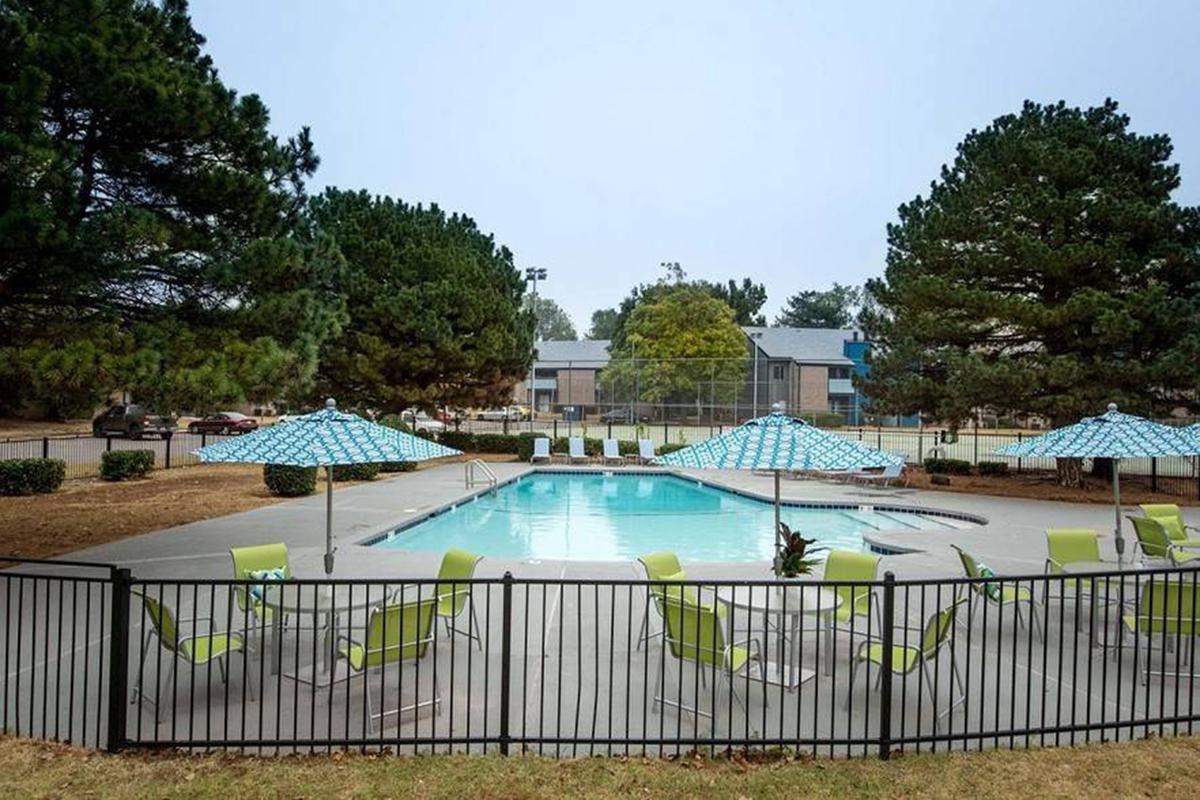 a pool next to a fence