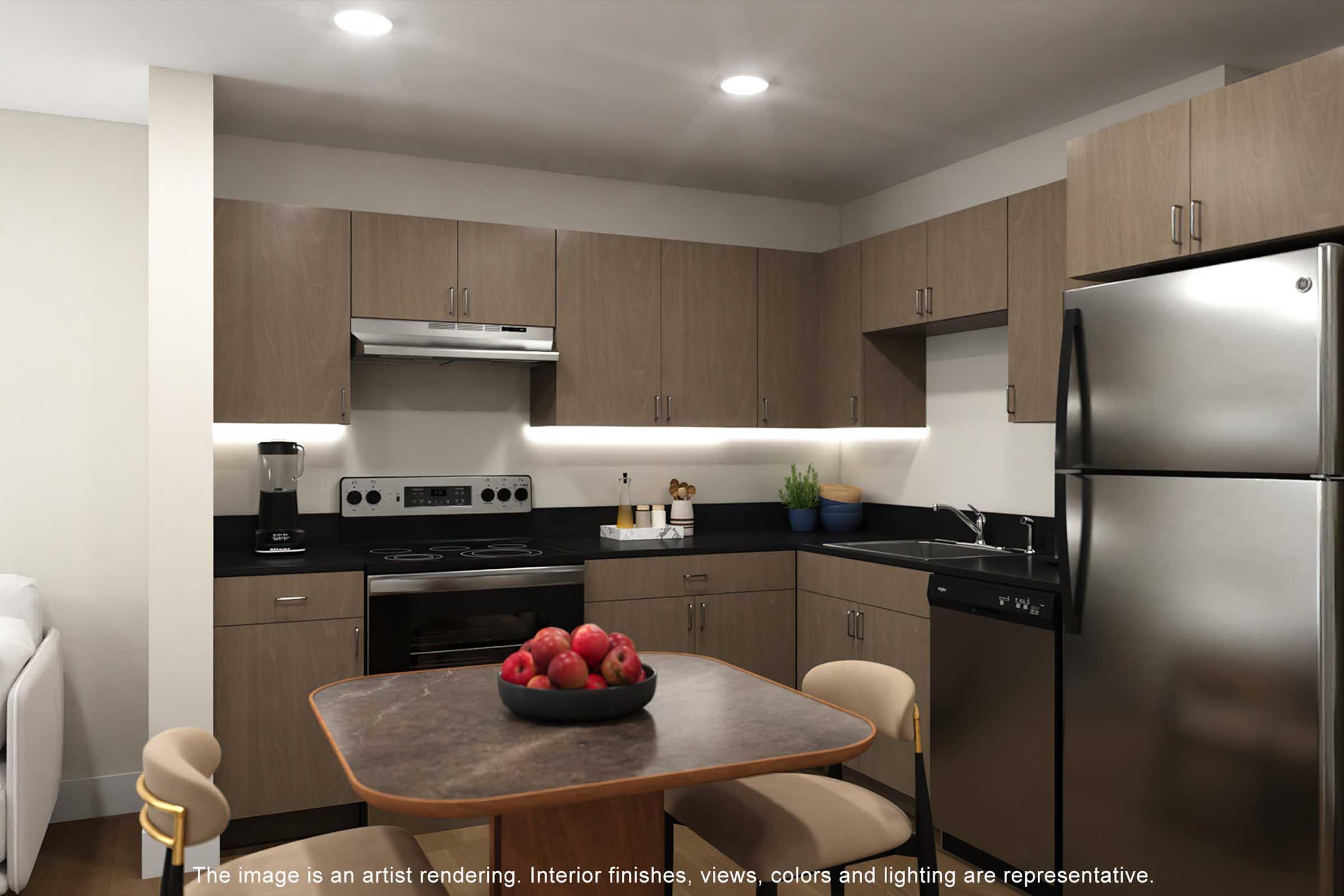 Modern kitchen with wooden cabinetry, stainless steel appliances, and a black countertop. A table with a bowl of red apples is in the center, surrounded by beige chairs. The kitchen features an oven, microwave, and sink with ambient lighting under the cabinets. Bright and inviting, designed for functionality.