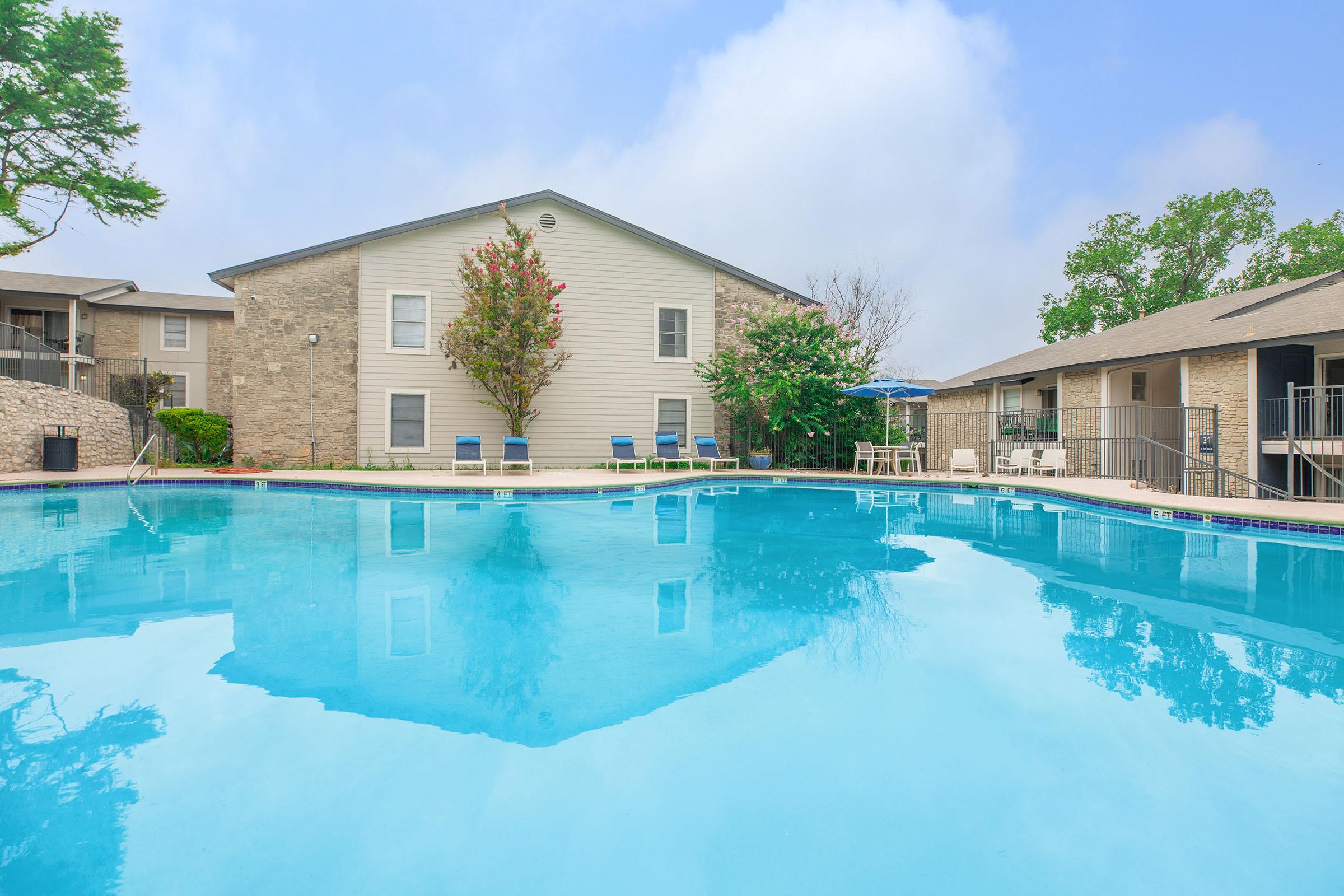 a house with a large pool of water