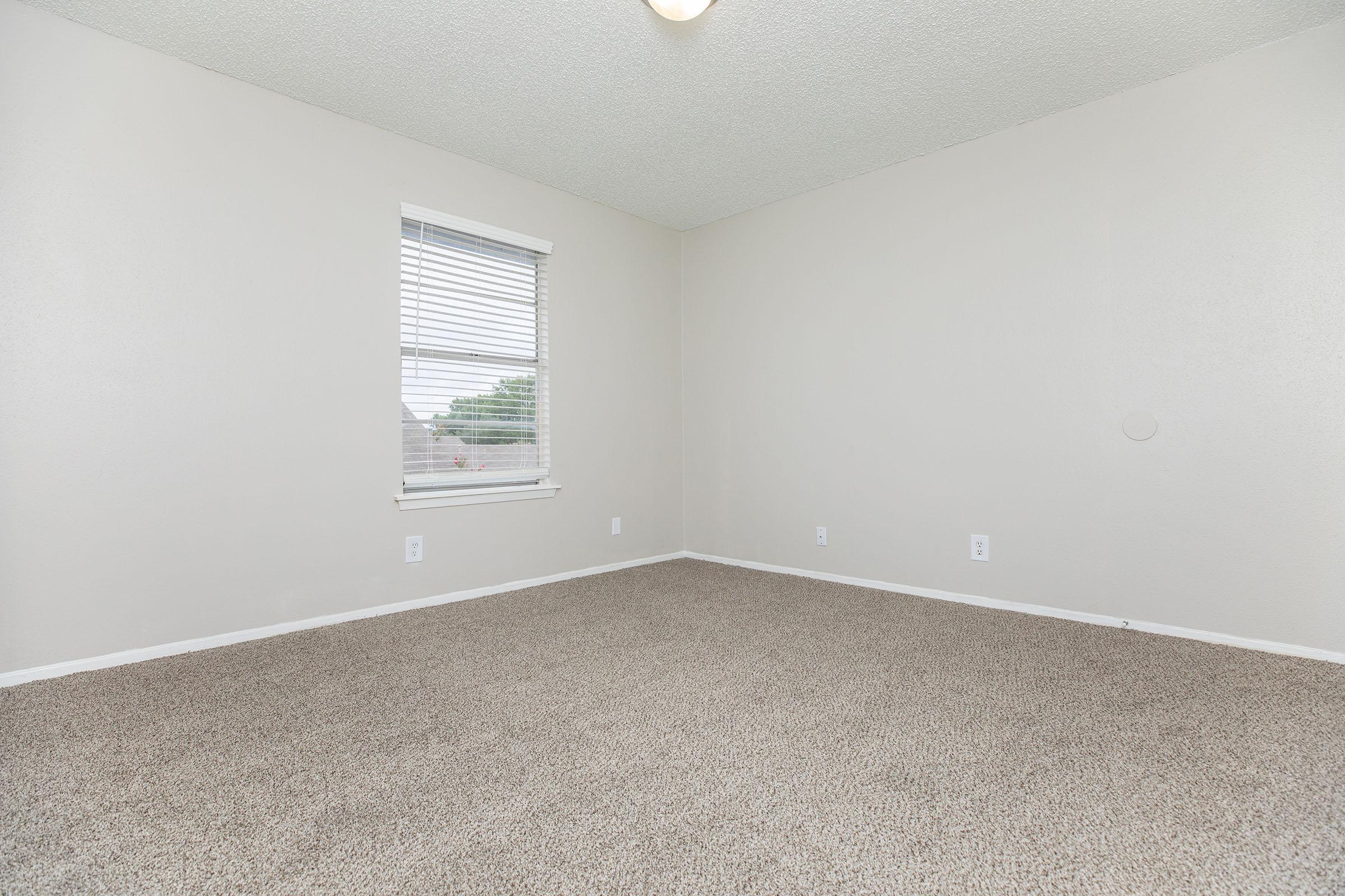 a bedroom with a large mirror