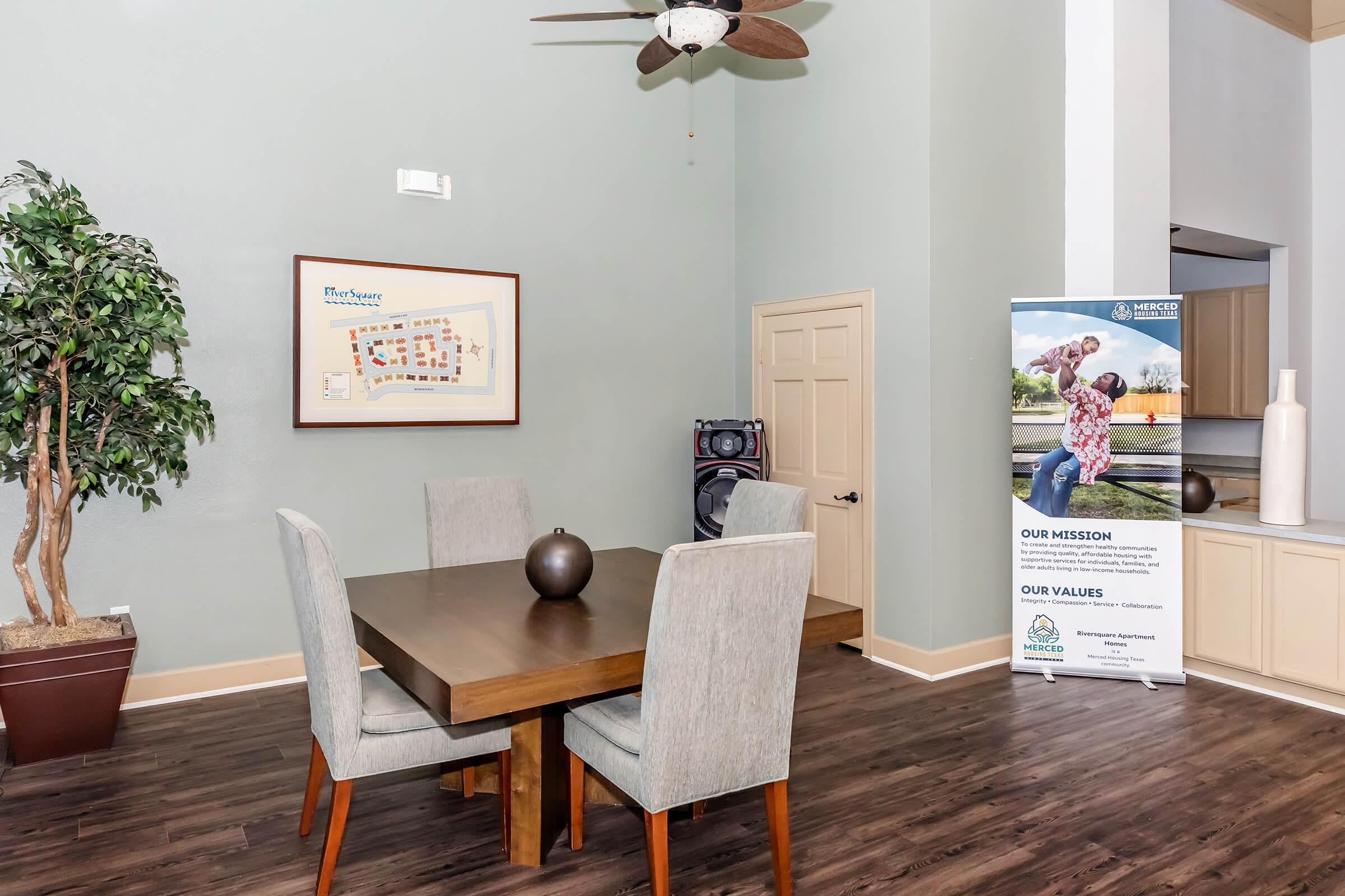 a living room filled with furniture on top of a wooden table