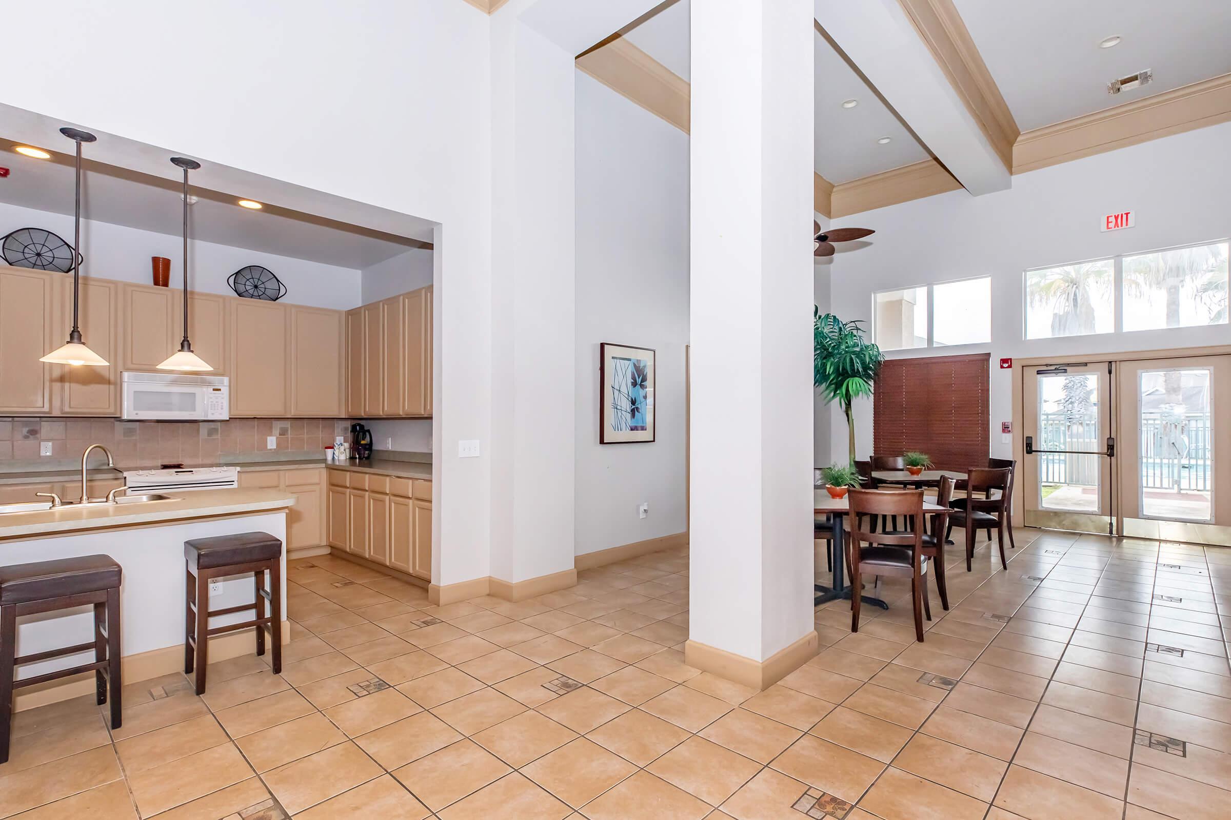 a kitchen with a dining room table