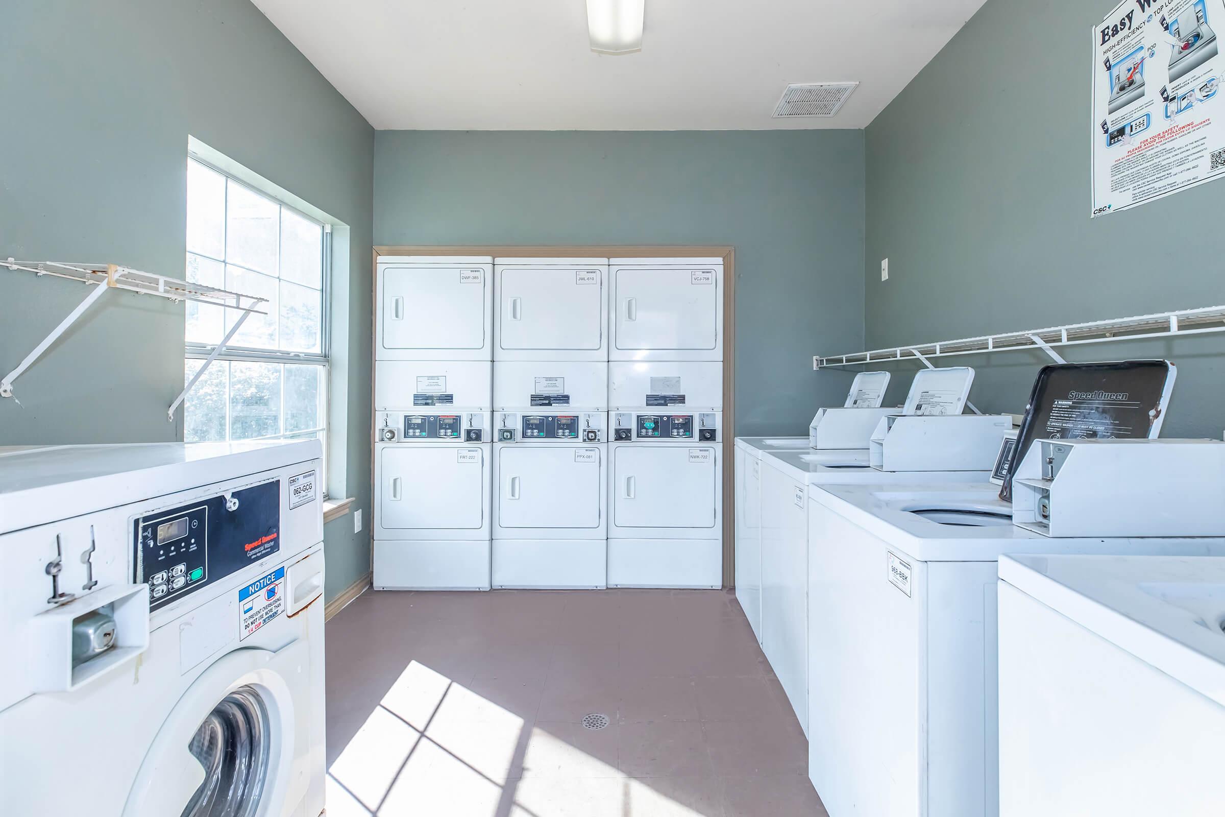 a kitchen with a sink and a mirror