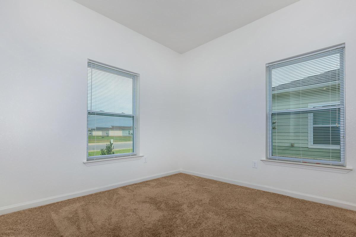 a corner of a room next to a window