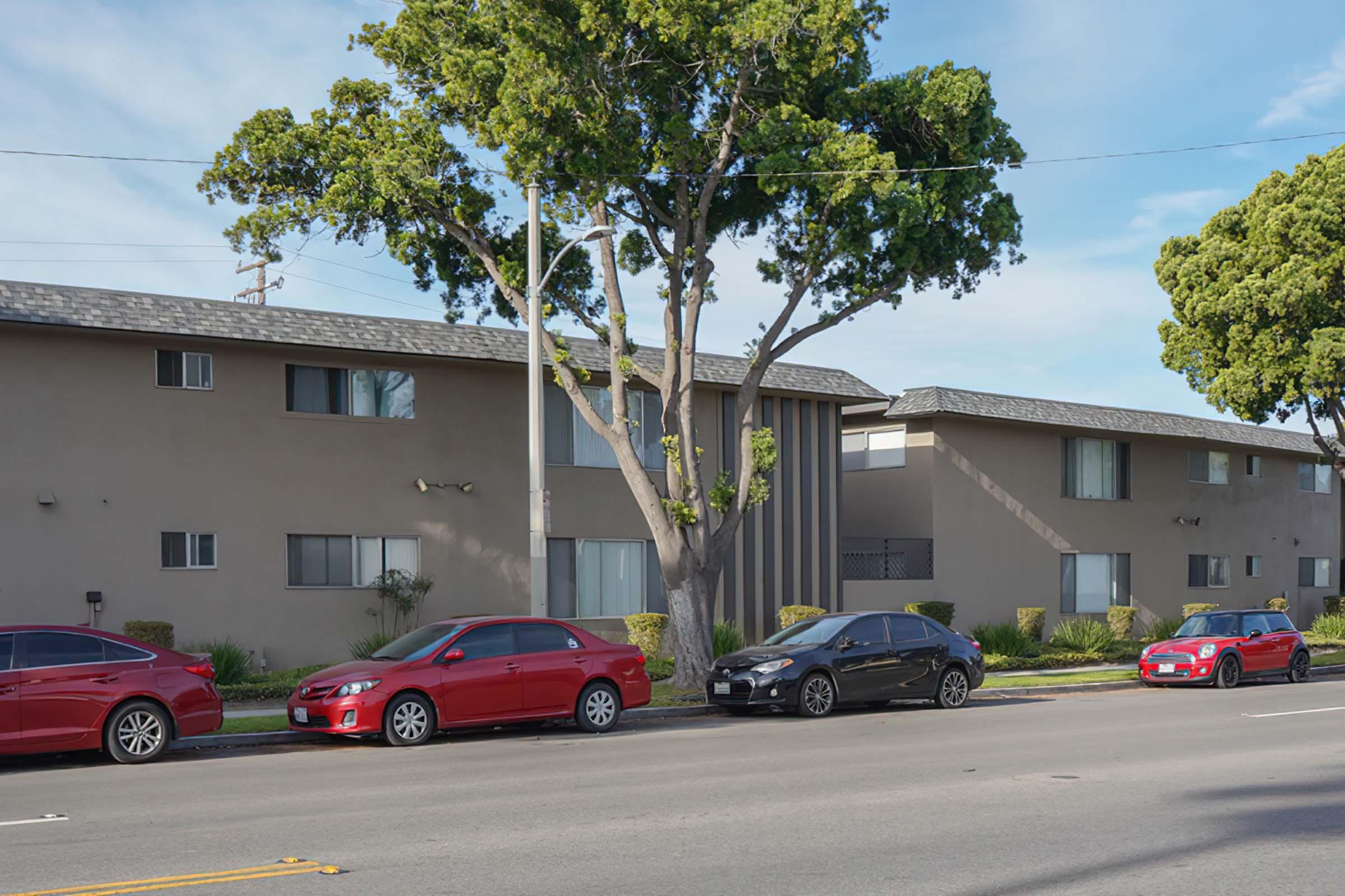 a car parked in a parking lot in front of a house