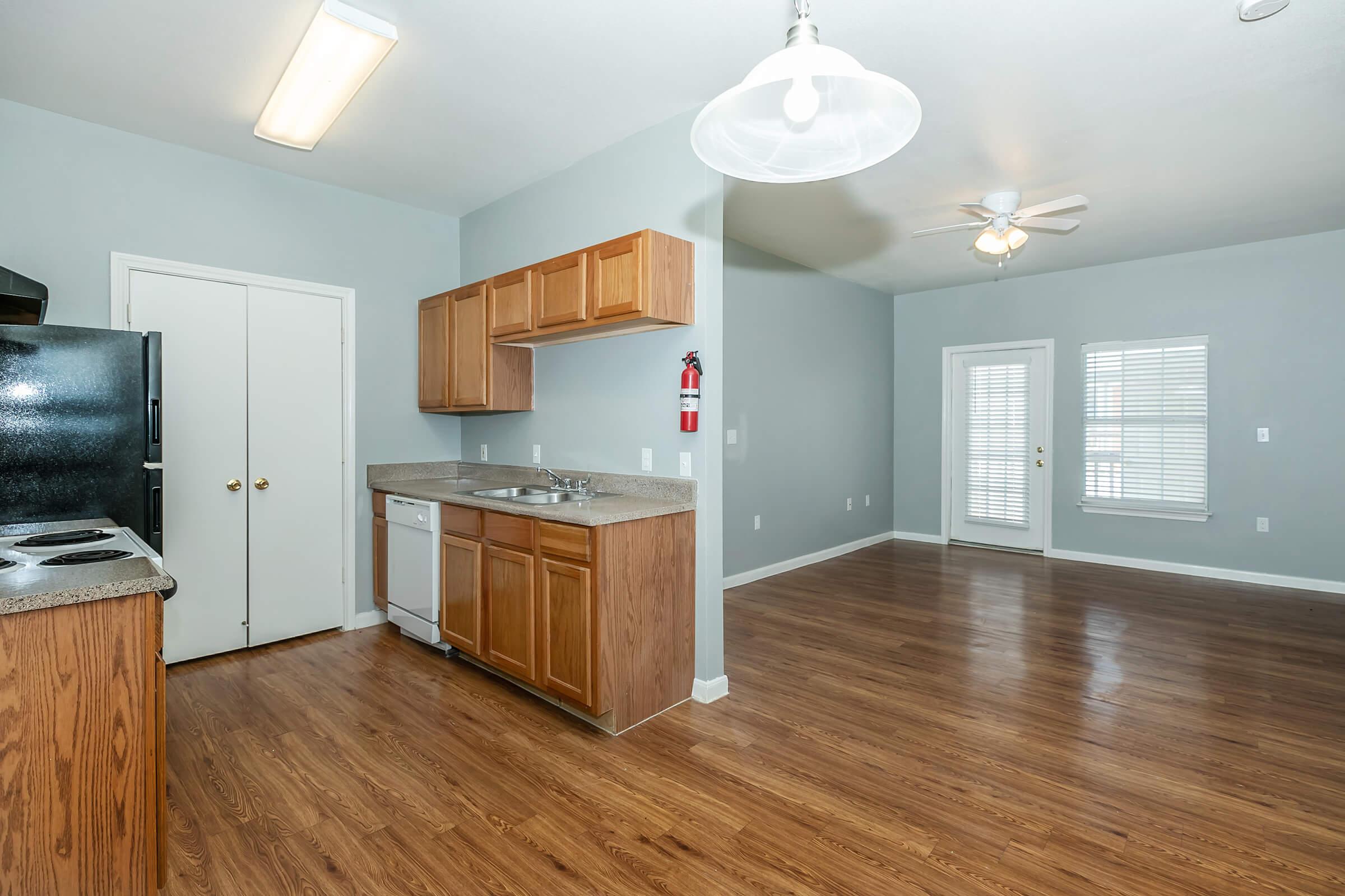 a kitchen with a wood floor