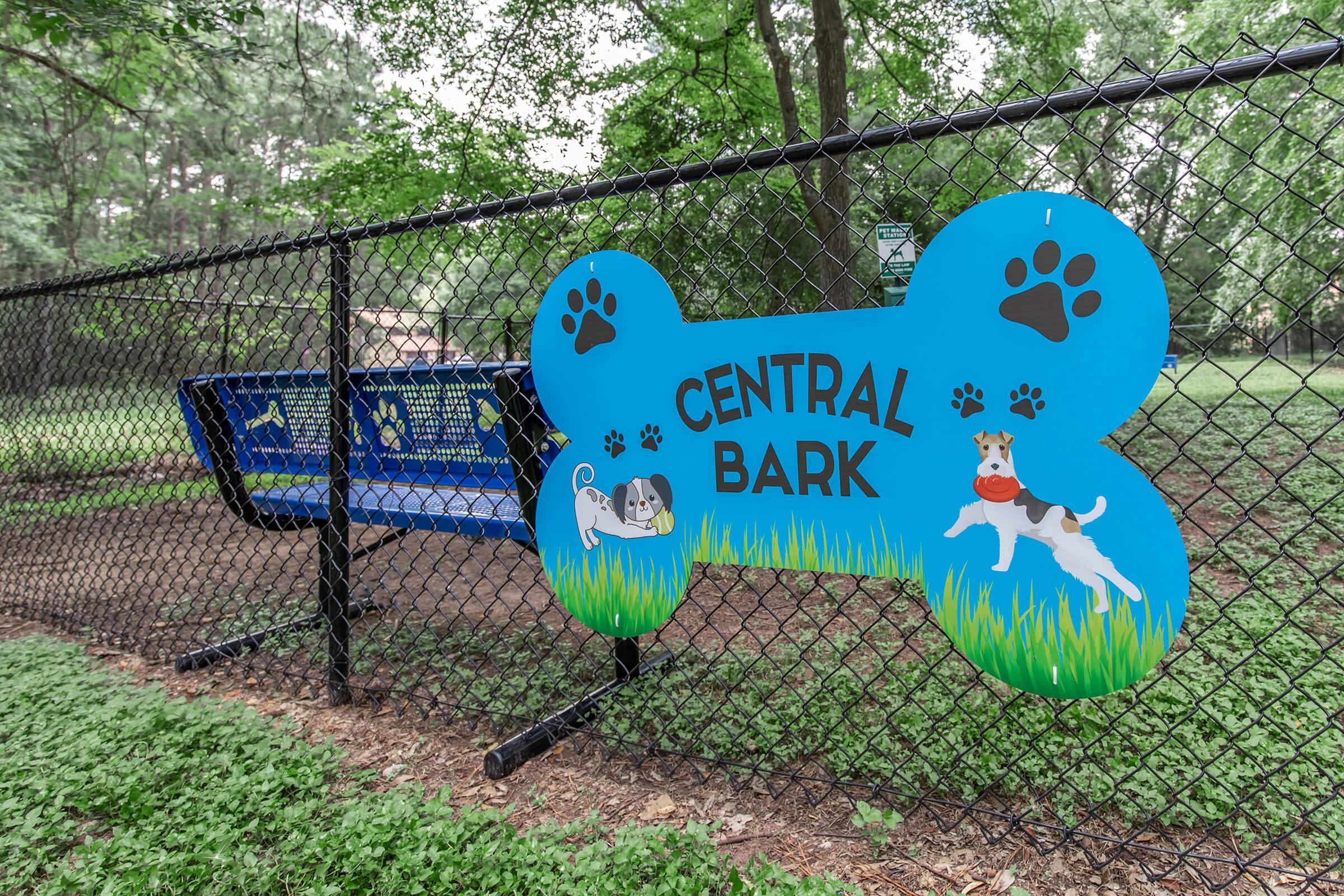 a sign on the side of a fence