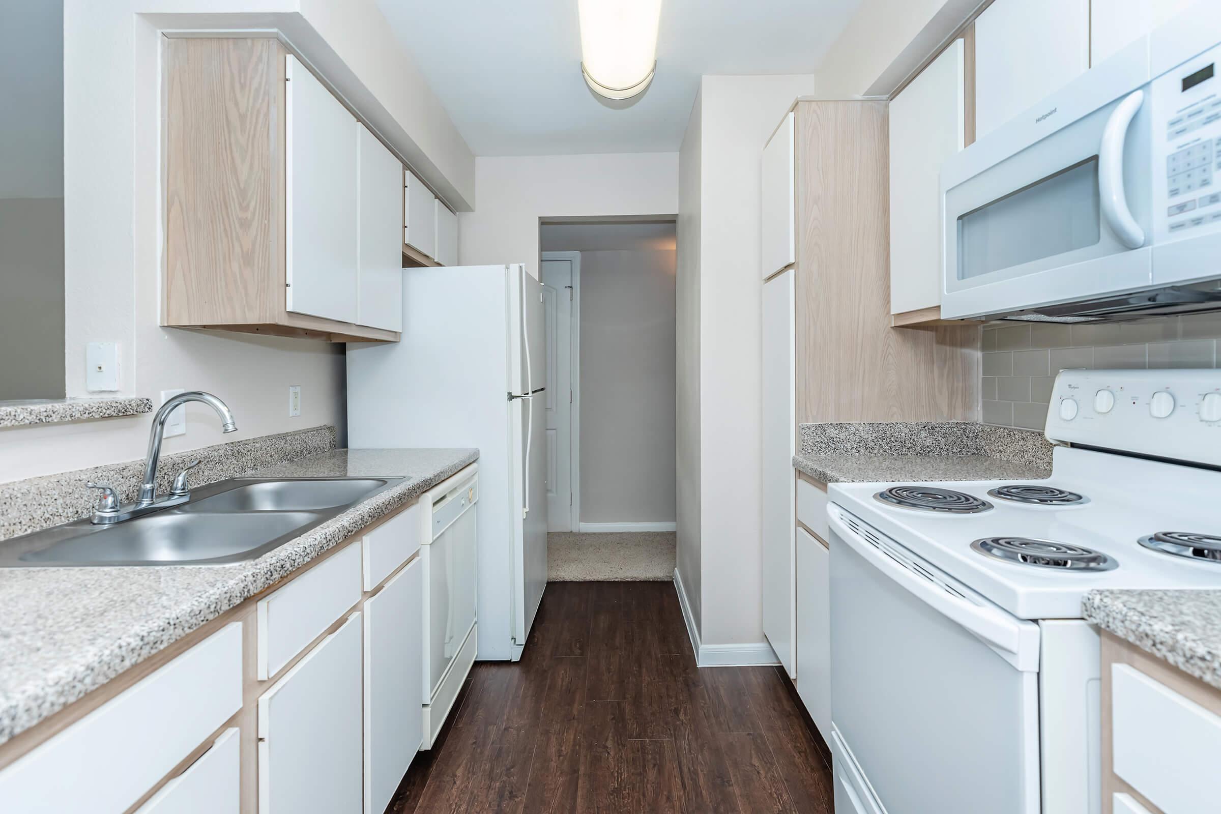 a kitchen with a stove and a sink