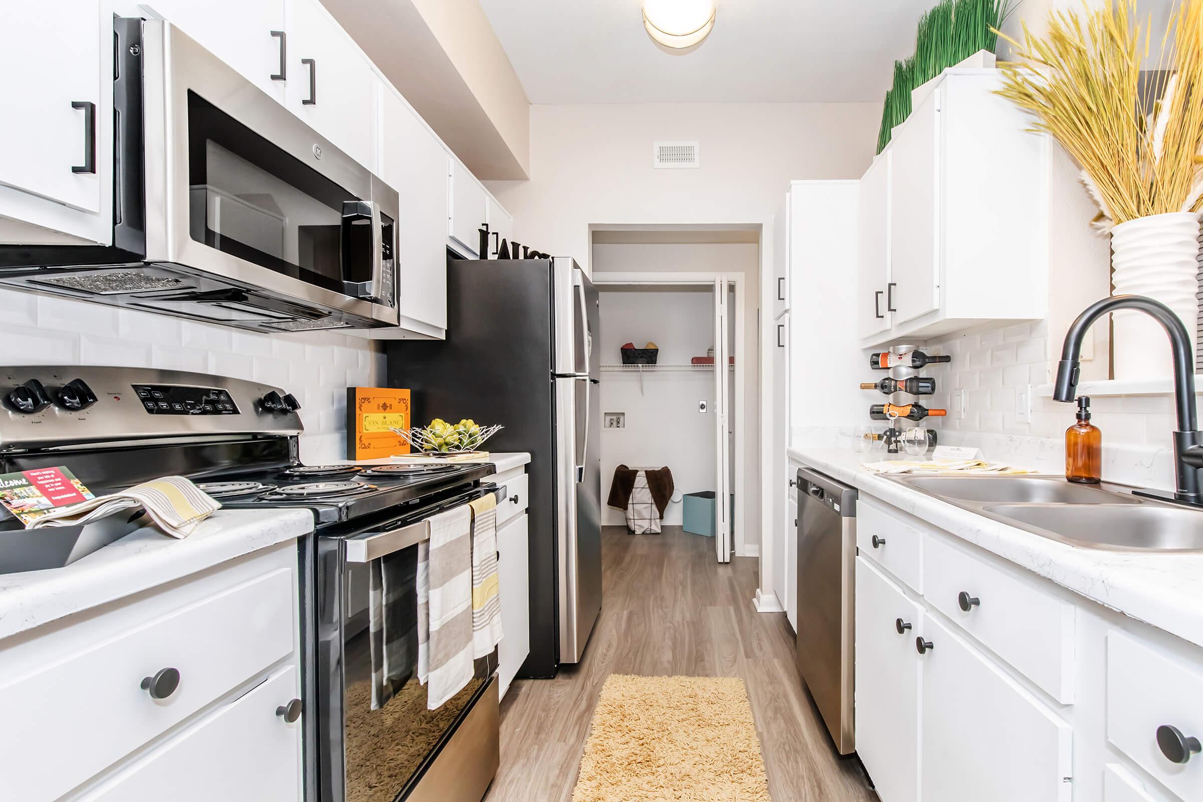 a large kitchen with stainless steel appliances