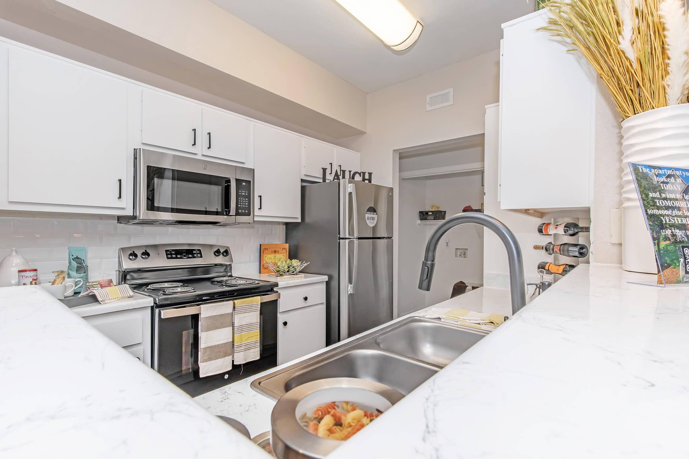 a kitchen with a sink and a counter