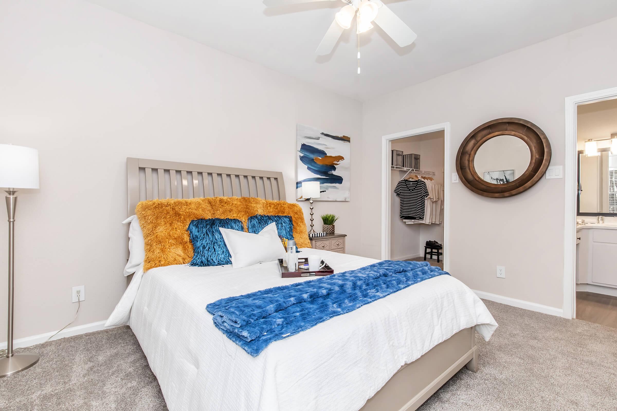 a bedroom with a large bed in a room