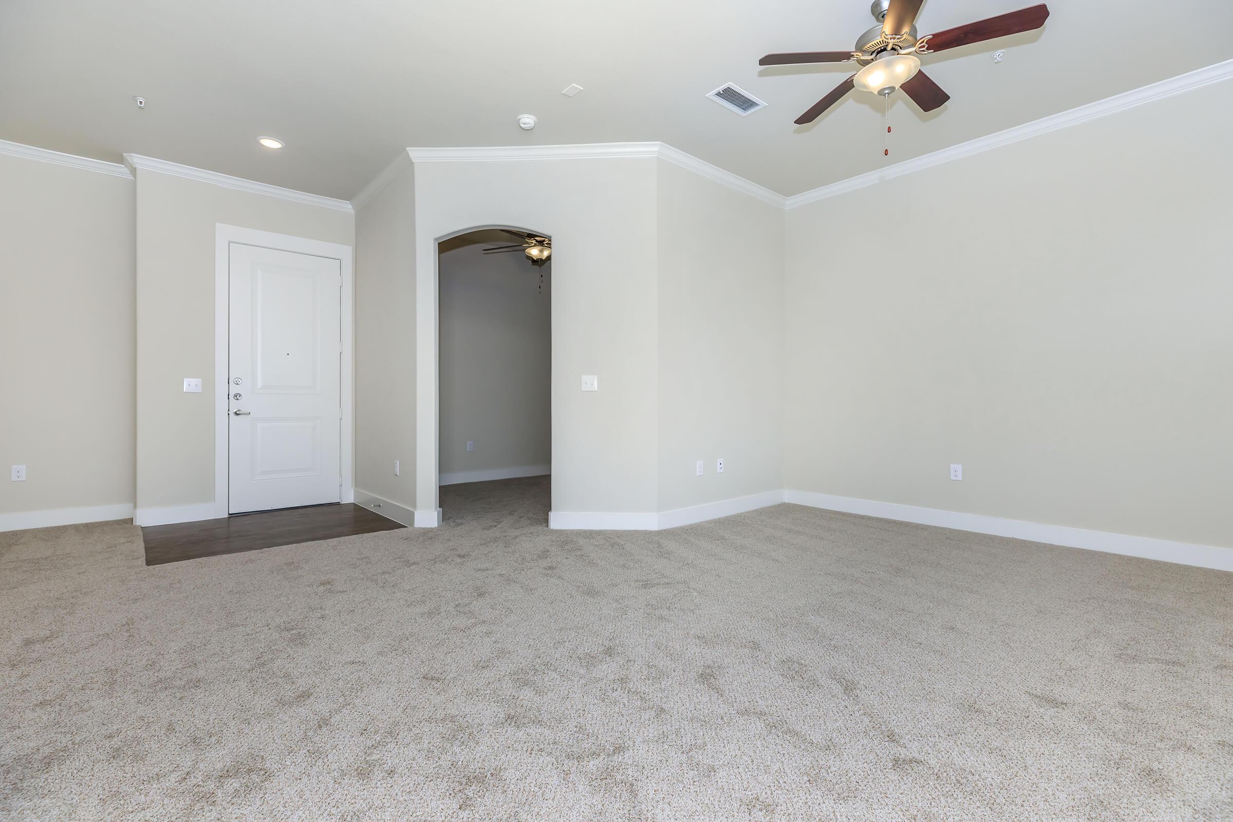 empty room at ivy point kingwood senior living apartments in kingwood tx featuring carpeted flooring and a walk in closet