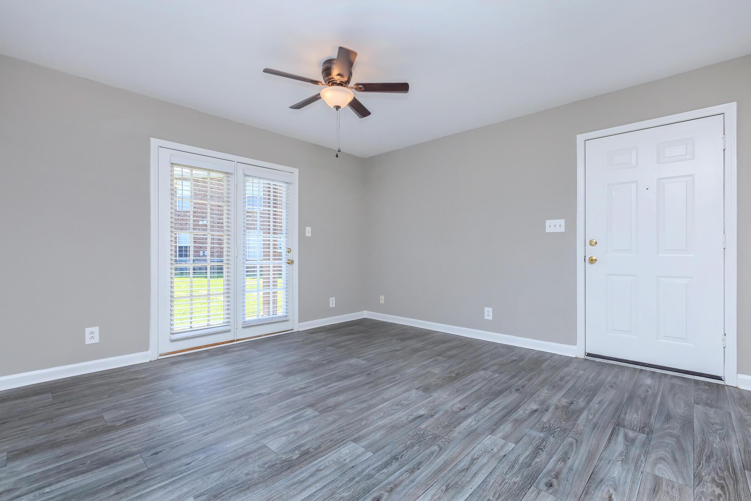 a bedroom with a large window