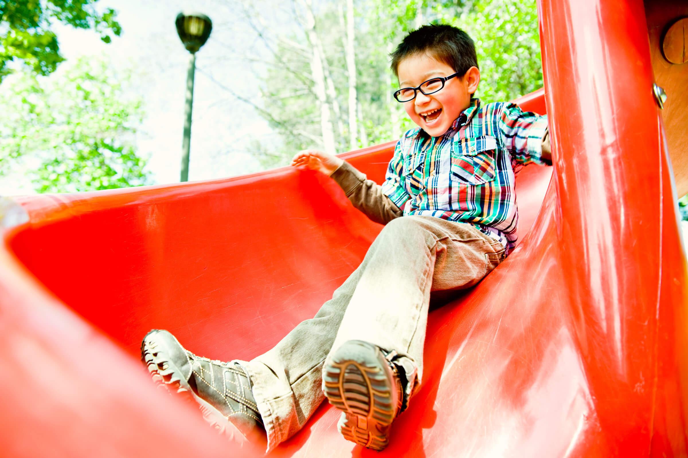a man sitting on a slide